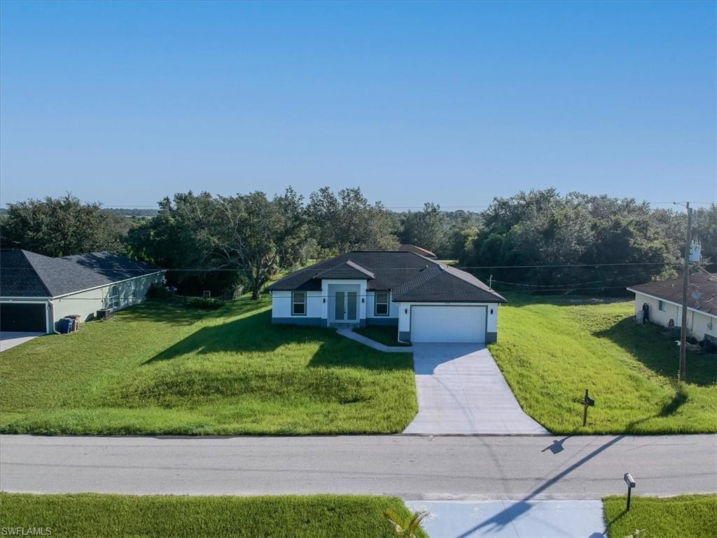 $10,000 Seller concession towards buyer closing costs and pre-paids. This newly constructed home in the desirable 33971 ZIP code offers the best price per square foot in all of Lehigh Acres.    Situated at 3005 20th ST W, this property is designed for comfort and durability, built on an elevated pad to prevent flooding. Featuring 3 bedrooms + a den, 2 bathrooms, and an open floor plan with soaring 9-foot ceilings and 10-foot vaulted accents, this home is filled with natural light and modern finishes.    Enjoy polished Venato porcelain tile flooring throughout, impact-resistant ECO WINDOWS, and sleek white quartz countertops in the kitchen. The spacious master suite boasts two walk-in closets and a luxurious freestanding shower with dual sinks.    For peace of mind, the seller—who is also the developer—includes a 2-10 Home Builders Warranty (including a 7-year structural warranty). With easy access to I-75, this home is just minutes from Fort Myers, Southwest Florida International Airport, and the stunning beaches of Sanibel & Captiva Islands.    This home is ready for immediate move-in and a quick closing. Schedule your showing today!