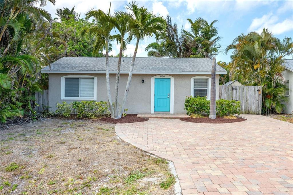 Beautifully upgraded in a relaxed coastal style, this turnkey Naples Park residence offers the perfect blend of refined interiors, effortless outdoor living and an exceptional location west of U.S. 41. Offered furnished and move-in ready, the three-bedroom, two-bath home is bathed in natural light and enjoys sought-after southern exposure, fenced yard and expanded brick paver guest parking. Inside, plank tile flooring flows throughout the open-concept design, creating a seamless and sophisticated aesthetic. The renovated kitchen features crisp white cabinetry, light stone countertops and a generous island that serves as the centerpiece for gathering and entertaining. Designed for the Florida lifestyle, the dining and living areas transition effortlessly to a spacious screened lanai overlooking the sparkling pool and fully fenced backyard. Whether hosting friends or enjoying a quiet evening at home, the outdoor living spaces provide a private tropical retreat. Low-maintenance xeriscape landscaping enhances the property's appeal while reducing upkeep, and the expanded brick-paver driveway offers ample parking for multiple vehicles. Ideally in one of Naples desirable coastal neighborhoods, this residence is just moments from the sugar-sand shores of Vanderbilt Beach and Delnor-Wiggins Pass State Park. Enjoy the convenience of nearby Mercato, Whole Foods, boutique shopping, acclaimed restaurants and vibrant entertainment venues, all within minutes of your doorstep. With no HOA fees or rental restrictions, Naples Park remains one of Naples sought-after opportunities for full-time residents, seasonal owners and investors alike, surrounded by a growing collection of luxury homes valued well into the multimillion-dollar range.