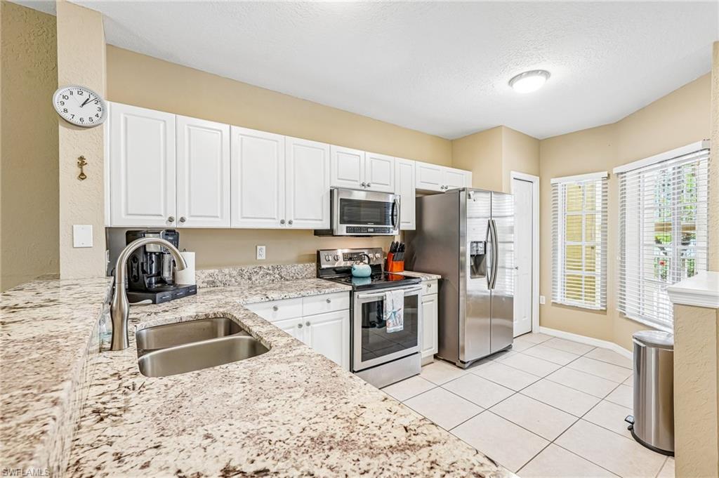 NEW PRICE ADJUSTMENT – EXCEPTIONAL NAPLES INVESTMENT OPPORTUNITY! Now offered at an even more attractive price, this beautifully maintained first-floor condo at 9185 Celeste Dr #103 combines flexibility, location, and outstanding rental potential.

Located in the desirable Coral Falls community within Lely Resort, this 2-bedroom, 2-bath residence offers one of the area's most appealing rental policies, allowing short-term rentals with only a 6-night/7-day minimum. Whether you're searching for an income-producing investment, seasonal retreat, or low-maintenance full-time residence, this property provides incredible versatility.

Inside, you'll find a bright, open layout with 9-foot ceilings and a comfortable flow throughout. The kitchen offers ample cabinetry and a convenient breakfast bar, while both bedrooms are generously sized, providing privacy for owners and guests. In-unit laundry adds everyday convenience.

Coral Falls is a boutique community situated on approximately 4.5 acres, offering a peaceful atmosphere with access to community amenities while keeping you close to everything Naples has to offer. Enjoy nearby golf, walking and biking paths, shopping, dining, and everyday conveniences. The property is ideally located approximately 20 minutes from both Downtown Naples and Marco Island's world-renowned beaches.

With its newly adjusted price, desirable first-floor location, flexible short-term rental policy, and excellent proximity to Naples and Marco Island, this condo presents an outstanding opportunity for investors and future homeowners alike.

Don't miss your chance to own a piece of Southwest Florida paradise; schedule your private showing today!