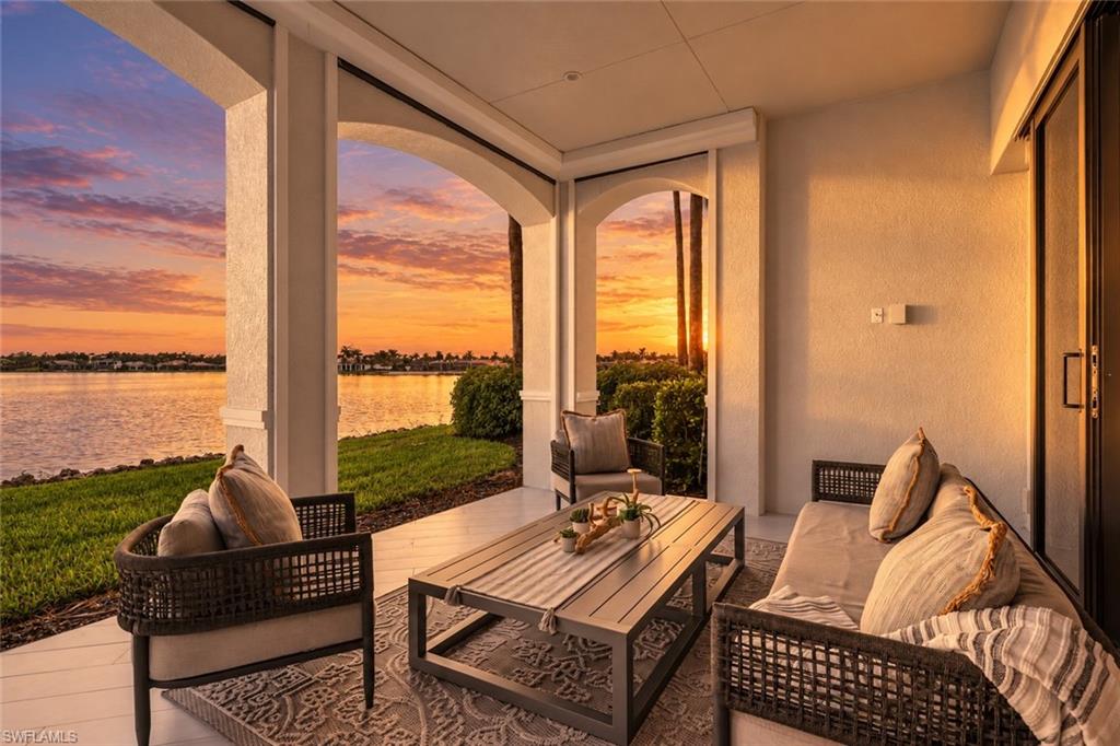 Experience elevated lakeside living in this beautifully transformed first-floor residence in Ravenna at Miromar Lakes Beach & Golf Club. Positioned to capture serene south-facing lake views, this sophisticated 3-bedroom, 3-bath home combines contemporary design, luxurious finishes, and effortless indoor-outdoor living. 

From the moment you enter, the residence makes a striking impression with a fresh, cohesive aesthetic and an array of thoughtful renovations. Wood-look tile flooring flows throughout the home, while sleek porcelain countertops have been introduced in the kitchen, bathrooms, laundry room, and outdoor kitchen for a polished, modern finish. Updated sinks, fixtures, ceiling fans, and designer details further enhance the interiors, creating a refined setting that feels both stylish and inviting. The residence is offered with thoughtfully selected designer furnishings, completing the move-in-ready experience.

The gourmet kitchen is designed for both everyday living and entertaining, featuring a spacious center island, abundant cabinetry, and a walk-in pantry with custom built-ins. The open layout creates an easy connection between the kitchen, dining area, and living space, while expansive glass doors frame the beautiful lake backdrop and extend the living space outdoors.

The primary suite offers a peaceful retreat with generous proportions and custom-built closets that provide exceptional organization and storage. Two additional bedrooms offer flexibility for guests, an office, or other lifestyle needs.

Step outside to the covered lanai and take full advantage of Southwest Florida's indoor-outdoor lifestyle. The fully equipped outdoor kitchen provides an ideal setting for casual meals and entertaining, while the tranquil lake views create a beautiful backdrop throughout the day.  For the boater, there is also the option to purchase a boat dock conveniently located near the home, providing access to Miromar Lakes’ expansive freshwater lakes.

Beyond the residence, Miromar Lakes offers an exceptional resort-style lifestyle centered around a 700-acre freshwater lake with boating, fishing, and water recreation. Residents enjoy a private white-sand beach, infinity-edge pool, full-service marina, championship golf, lighted tennis and pickleball courts, state-of-the-art fitness center, luxurious spa and salon, and waterfront dining. This exceptional Ravenna residence delivers the ideal combination of sophisticated renovations, beautiful lake views, designer style, and access to one of Southwest Florida's most sought-after private communities.