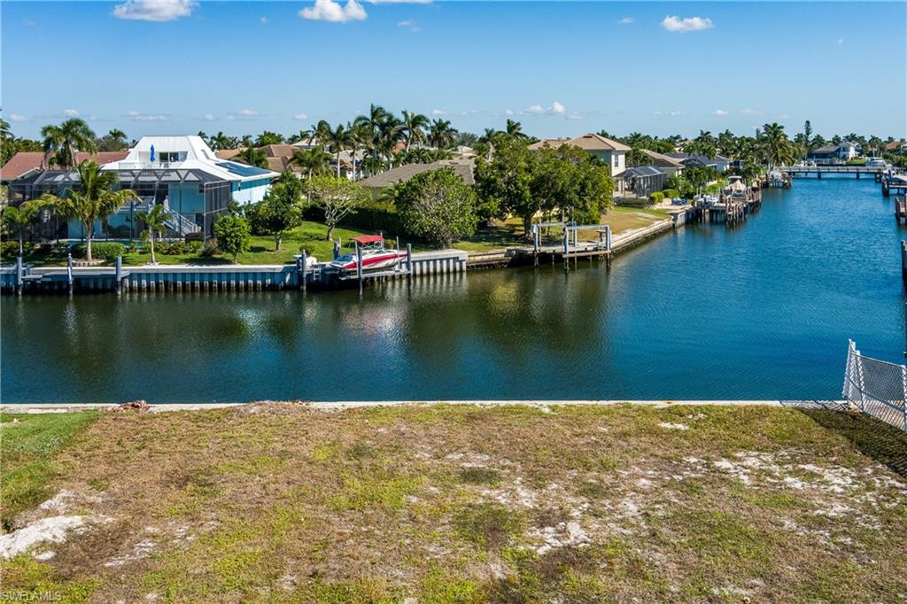 Prime waterfront lot available for building your dream home. Beautiful long water view. Only one bridge to the Gulf of Mexico. Located near Tigertail Beach area and the security gate for the Hideaway Beach Community. This property is clear of trees and ready to build.