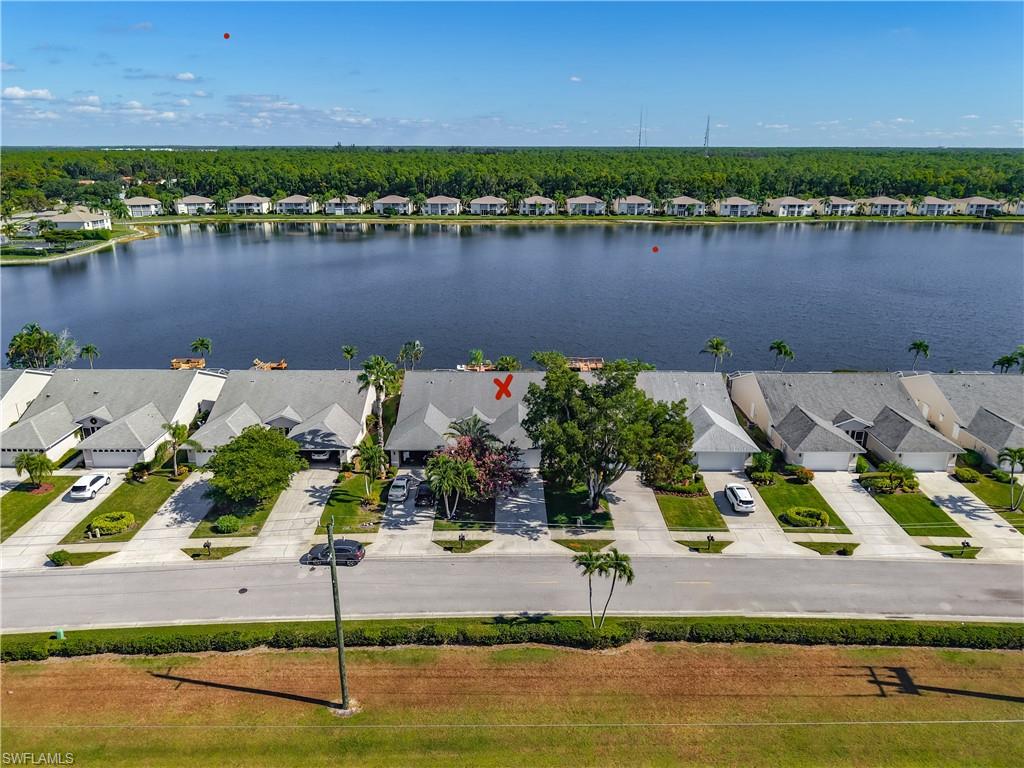 Spectacular lake front view on one of the largest lakes in Naples.  Lake can be seen from living room, kitchen, sunroom, lanai and master bedroom.  Two bedroom plus a den with two car garage.  The floating dock is shared  with villa neighbors and may be used for fishing and launching your kayak or just lounging on the dock.  Freshly painted throughout with new hot water heater, dishwasher, stove and washing machine. Updated river rock tile floors in both showers. Villa is bright and sunny with natural light and ceiling lights.  Lanai access from sunroom, extension of living room and master bedroom.  Lake, dock access from lanai.  Dock is a peaceful place to relax, feel the gentle breeze and bird watch.  Turn east for sunrises and face west for sunsets.  Walk to the clubhouse and enjoy the beautiful oversized pool with tranquil lake views and shade.  Also available are wonderful walking options, exercise room and pickleball/tennis courts.  Crown Pointe is a hidden jewel located off Davis Blvd with close proximity to downtown Naples with many dining options and shopping.  Enjoy the white sandy beaches of Naples just a short 15 minutes away.  Lakeport Villa association is a great neighborhood.  It is friendly and welcoming with quiet neighbors.  Shore birds, including egrets, herons, ibis and the occasional pelican are added attractions with the nature views of Lakeside living.