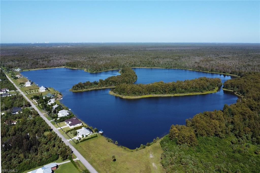 Rare Opportunity in Exclusive Southwest Florida lakeside Enclave… Imagine waking to breathtaking sunrises and ending your days with stunning sunsets from your private 2.27 acre homesite. Nestled in one of Southwest Florida’s most exclusive communities—limited to just 20 custom homesites—this is a truly rare chance to build your dream single-family home. Enjoy a serene 150-acre lake and a wide, 60-foot landscaped path wraps around the lake, perfect for leisurely walks, biking, boating or simply savoring the tranquil beauty of your surroundings. Just steps beyond the community lies a 12-mile trail bordering the pristine Bird Rookery Swamp, part of the expansive 60,000-acre Corkscrew Regional Ecosystem Watershed (CREW). Birdwatchers, nature lovers, and outdoor enthusiasts will delight in endless opportunities for exploration right outside your door. This peaceful, private setting masterfully balances untouched natural beauty with sophisticated luxury living. Don’t miss this exceptional opportunity to create your custom retreat in paradise.