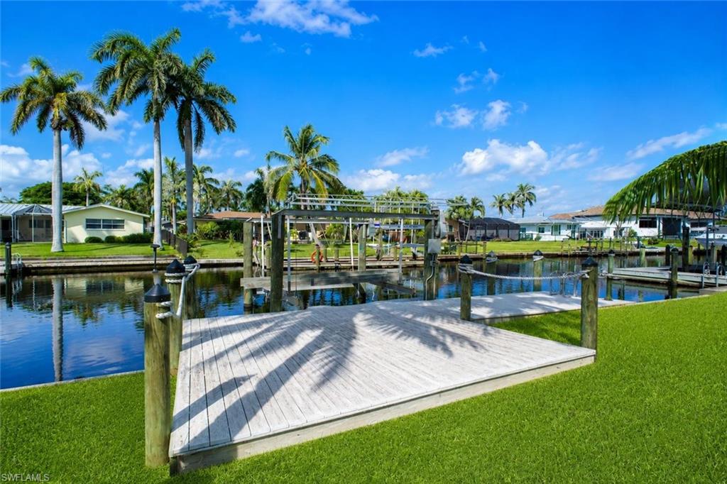 One or more photo(s) has been virtually staged, AI generated or rendered.  * APROVED LUXURY RESIDENTIAL PROJET PERMIT.    Exclusive Waterfront Vacant  Lot - 5259 Skylark Ct, Cape Coral FL.  The aproved permit is backet by a Highly experienced Miami Luxury Home Buider with more than 27 years os experience in HIGH-END and LUXURY Residential Construction. A prime Boating Location. The existing SEAWALL adds significant value and makes this property an aoutstanding oportunity for anyone looking to create a new luxury waterfront residence. THE LOT IS CLEARED, THE SEAWALL IS IN PLACE, THE PROYECT PERMIT IS APPROVED, THE WATER IS WAITING. One or more photo(s) has been virtually staged, AI generated or rendered. 
Sea Wall-Open water acces.An exceptional oportunity to build a espectacular waterfront resident in Cape Coral. The previos older home has demolished, leaving a clean waterfront lot ready for new construcction. Even more valuable, property has an aproved Construction permit and Luxury Home Project designed in accordance with the 2023 elevation code requirements. 5 Bebrooms, 5 bathrooms, Great room, Designer kitchen, Private Home Theater, 3 car garage, Future Swimming Pool, Jacuzzi/spa and Expansive Pool Deck.
Aproved Project Details: *Residential Occupancy R3, *Construcction Type V-B, *2023 Elevation Code, Existing Sewall, *Cleared Waterfront Lot.   Build new. Build Better, Built for the Future. Rendered and virtual photos in this advertisement.