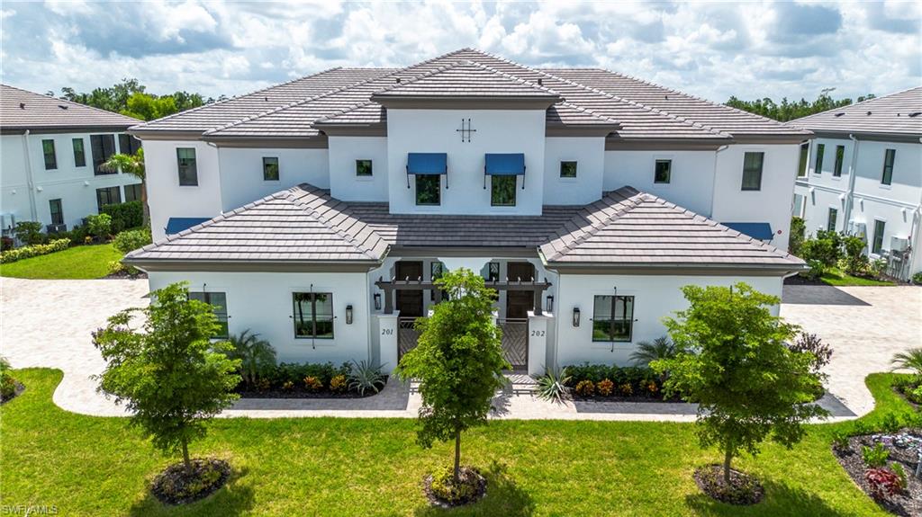 Introducing Nerano, a new coach home neighborhood by Front Door Communities located within the award-winning Miromar Lakes Beach & Golf Club. This limited collection features 10 buildings with four residences each. With 3 homes available for occupancy by March 2026. And 4 Homes ready by November 2026 
This designer-coach home offers a private entrance, open-concept great room, volume ceilings, and a gourmet kitchen with large island. The floor plan includes 3 bedrooms and 3.5 bathrooms, a screened lanai with serene lake and preserve views, and an attached 2-car side-entry garage. Buyers may select from ground-floor or top-floor configurations Top floor offers a private den and choose from available customization options. Furniture package available at additional cost.
Residents of Miromar Lakes enjoy access to a 700-acre freshwater lake, 3 miles of white-sand beach, a 10,000 sq. ft. zero-edge infinity pool, three onsite restaurants, European spa and salon, fitness center, tennis, pickleball, bocce, racquetball, and the Arthur Hills Signature Championship Golf Course. Concierge services and an extensive lifestyle program complete this exceptional community. NOTE* The video/virtual tour provided represents a fully furnished model unit of the same floor plan. The actual available unit is sold unfurnished and may vary slightly in orientation, view, lighting, or specific finishes. Please contact the listing agent for exact details.