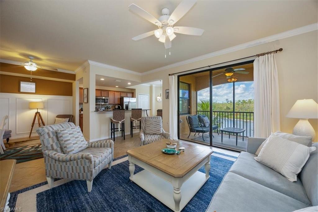 Treviso Bay Golf Membership? Yes, please! Get a coveted golf membership and an amazing Florida lifestyle - where the sun shines and the beach calms - in this beautiful two-bedroom, two-bathroom, third floor home! You'll enjoy 1,232 square feet of elegance in a thoughtfully laid out floorplan with wall molding in the entryway, granite and stainless steel in the kitchen, a dinette with a water view, an open den, and a screened balcony with an expansive lake view. Located just 5 miles south of downtown Naples, Treviso Bay offers a special, unique, and welcoming living experience. Architectural distinctiveness, natural surroundings in and around the Rookery Bay National Estuary, first-class amenities, and an unsurpassed lifestyle are the hallmarks of the community. Whether playing on a spectacular TPC golf course, enjoying tennis, Bocce, pickleball, fitness activities, the luxuries of a spa, use of beautiful pools, extraordinary dining experiences or social entertainment, Treviso Bay delivers an exceptional lifestyle in an unrivaled setting. Residents are fortunate to have the ability to venture out to the incomparable vitality of nearby downtown Naples, Marco Island, pristine beaches, and close-at-hand marine and cultural pastimes. TREVISO BAY HAS IT ALL!