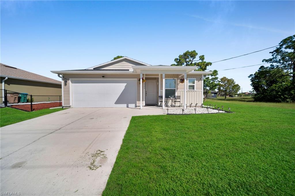 Built in 2019 and move-in ready. This 3 bedroom, 2 bath home in northwest Cape Coral sits on an oversized 0.23 acre double lot with no HOA.

Tile runs through the whole house. The kitchen has wood cabinets, stainless appliances and plenty of counter space, and it opens to the dining and living area. The primary bedroom has its own bath with dual sinks. Washer and dryer are inside the home and stay with it.

One wing of the home has its own exterior entrance, a kitchenette and a full bath next to a bedroom. It works well for guests or a home office.

Outside you get a 2-car garage, a long paved driveway, a partially fenced backyard with mature shade trees and a roof replaced in 2023. Schedule your showing today.
