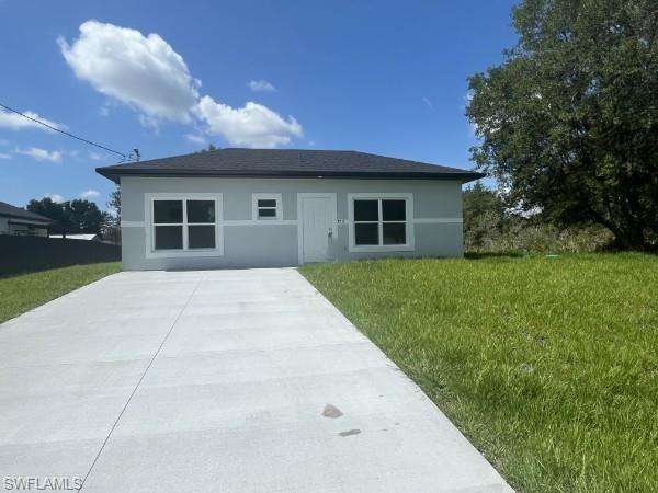 Discover a one-of-a-kind, brand-new 1-bedroom, 1-bath cottage style home in Lehigh Acres. This modern design home features beautiful tile flooring throughout, granite counters, a chef’s kitchen with plenty of cabinets, pantry space and a full appliance package. The primary bedroom offers a huge walk-in closet, while the spacious bathroom includes a large tiled shower. Additional highlights include impact storm-protection windows, inside laundry with washer/dryer hookups, modern lighting and fixtures, abundant natural light, a covered rear lanai, and pet-friendly policies.  Photos may not be of actual unit- for marketing purposes only. Seller contributes $5k to closing cost.