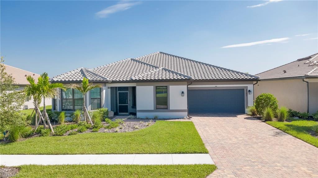OVER $300,000 IN BUILDER UPGRADES, an EXPANSIVE OUTDOOR RETREAT, and an OVERSIZED LOT distinguish this LIKE-NEW REVERENCE floor plan at 6262 Glory Rd in DEL WEBB NAPLES, a 55+ COMMUNITY in AVE MARIA. BUILT IN 2025, this beautifully appointed home offers 3 BR+DEN, 3 FULL BATH, and 2,716 SQFT of living space. Situated NEAR A CUL-DE-SAC on approximately 0.24 ACRES, the property also benefits from an easement along one side, adding separation from the neighboring home.

WOOD-PLANK TILE flows throughout, complemented by UPGRADED LIGHT FIXTURES & CEILING FANS. The kitchen showcases UPGRADED LEVEL 4 WHITE CABINETRY paired with an ADMIRAL-COLORED WRAPPED ISLAND, LEVEL 5 QUARTZ COUNTERTOPS, and a MATCHING QUARTZ BACKSPLASH for a seamless look without grout lines. BUILT-IN KITCHENAID APPLIANCES, a BEVERAGE COOLER, and UNDERCABINET LIGHTING complete this thoughtfully upgraded space.

POCKET SLIDING GLASS DOORS open the gathering room to an impressive screened outdoor living area. The NEARLY 1,300-SQFT ENCLOSURE features PICTURE-FRAME SCREENING, approximately 1,021 SQFT OF BRICK PAVERS, and a 10-BY-24-FOOT POOL & SPA and WATERFALL FEATURES. A 370-SQFT COVERED LANAI provides additional room for outdoor dining and lounging, while a POOL-ACCESS BATHROOM adds convenience. The lanai is also PREPPED FOR AN OUTDOOR KITCHEN, with electrical outlets, a vent, and plumbing connections in place for future installation.

The bathrooms feature CUSTOM MIRRORS and SHOWERS WITH CEILING-HEIGHT WAVY WHITE ICE BRIGHT WALL TILE and FRAMELESS HEAVY DUTY GLASS DOORS. The primary bathroom includes a WALK-IN SHOWER. Additional highlights include IMPACT WINDOWS AND DOORS, an EPOXY-COATED GARAGEFLOOR, and a 2-CAR GARAGE WITH A SEPARATE GOLF CART BAY.

Enjoy access to Del Webb Naples’ resort-style amenities, with OPTIONAL GOLF MEMBERSHIPS available for golf enthusiasts, along with the shopping, dining, and community activities of Ave Maria. Ave Maria: where community meets paradise.