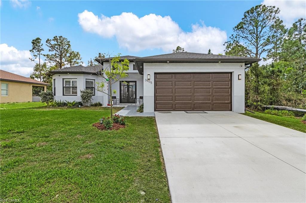 Spectacular house in excellent conditions. Open concept floor plan futures 4 bedrooms, 2 bathrooms, 2 cars garage, laundry in residence and HUGE extended screened lanai. Inside offers coffered ceilings in living room and 10ft high ceiling in the rest of the home and 8ft doors and sliding doors, beautiful plan tile throughout. Kitchen has quartz countertops, white shaker cabinets with 42" uppers, slow close hinges, integrated pantry, stainless steel appliances and modern tile backsplash. Master Bath has quartz on vanities, dual sinks and and large walk-in shower. This home comes fully equipped with light fixtures, fans, gutters, sprinkler system, auto garage door, hurricane shutters and more. This home is located in a very desirable area of Lehigh, beautiful view in the backyard from the GAZEBO, close to state 82 and 75, Lee Blvd. Short distance to the high school, quick access to Fort Myers, Ft Myers international airport, schools, shopping plazas and more. Don't miss the opportunity to get this Unique property!