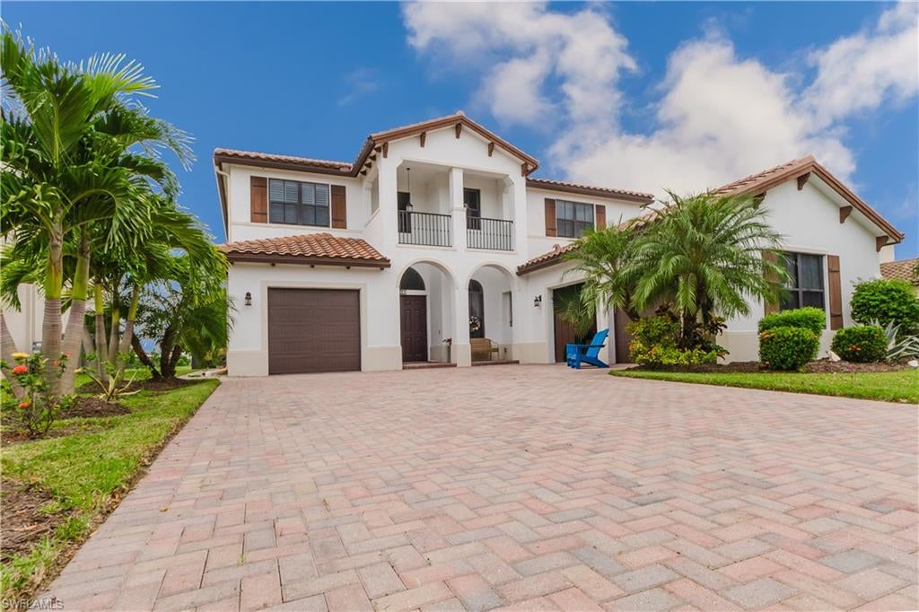 Welcome to this beautiful two-story home in the highly desirable Maple Ridge community of Ave Maria! Offering over 4,000 square feet of living space, this spacious 4-bedroom plus den/loft, 3-bathroom residence features a thoughtfully designed floor plan, beautiful architectural details, and exceptional indoor-outdoor living.
One of the home's standout features is its two primary suites, one conveniently located on the main level and another upstairs, providing flexibility and privacy for family and guests. The spacious primary retreat features separate his-and-hers bathrooms, while the home offers an abundance of closet space throughout.
Step inside to discover soaring vaulted ceilings, elegant archways, beautiful oak stairs, and an open, light-filled layout. Additional features include impact-resistant windows and doors, plantation shutters upstairs, kitchen lighting with dimmers, and French doors leading to the pool area.
Enjoy breathtaking lake views and stunning Southwest Florida sunsets from your private screened lanai, complete with a sparkling pool and spa. The lanai is also prewired for music speakers, creating the perfect atmosphere for relaxing or entertaining. An added bonus is the home's solar panel system, which will be paid off in full at closing!
Located in the amenity-rich Maple Ridge community, residents enjoy access to a beautiful clubhouse, resort-style community pool, fitness center, tennis courts, dog park, walking paths, and more. Just minutes from Ave Maria's charming town center, shopping, dining, parks, and community events.
With its generous living space, flexible floor plan, impressive features, and picturesque waterfront setting, this exceptional home offers the perfect opportunity to experience the best of the Ave Maria lifestyle!