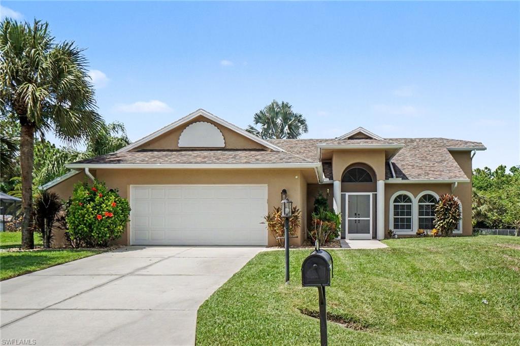 TWO EQUAL PRIMARY SUITES & THREE SETS OF POCKET SLIDERS TO THE POOL, WOW! THIS CUSTOM-BUILT POOL HOME ON HALF AN ACRE is truly a unique Lehigh Acres property offering privacy, space, and an impressive list of updates. Originally custom-built, this 3-bedroom, 2½-bath home sits on approximately ½ acre with no pass-through traffic, creating a peaceful and private setting. From the moment you enter through the French doors, the home's character is apparent with arched windows, an expansive living space, and dramatic 8-foot-high pocket sliders that open the home to the covered lanai and sparkling pool. In total, three sets of pocket sliders provide an exceptional indoor-outdoor living experience and beautiful views of the pool area. One of the home's most distinctive features is its two equally sized, mirror-image primary suites. Each suite features pocket sliding glass doors overlooking the pool, creating a private retreat with an effortless connection to the outdoor living space. The updated kitchen features solid wood cabinetry, granite countertops and backsplash, a new refrigerator and microwave, and a pantry for additional storage. The extra-large laundry room also houses part of the A/C system indoors, keeping it protected from the elements. Step outside and enjoy Florida living from the large covered lanai and expansive screened pool area. The pool is electrically heated for added year-round enjoyment and features a newly installed underwater light. The lanai is equipped with electric roll-down hurricane shutters, allowing the under-truss area to be enclosed when desired. Thoughtfully constructed with extra insulation in both the roof and walls, the home also offers an extensive list of improvements, including a new roof, new A/C, exterior paint, updated landscaping and tree trimming, landscape lighting, water softener system, new water pump, sprinkler controller, garage door opener, new smoke detectors, replacement of all three toilets, updated bathroom cabinetry and countertops, ceiling fans, faucets, and new flooring throughout approximately half of the home. An exterior alcove conveniently houses most of the home's exterior systems. The oversized two-car garage provides plenty of room for parking and storage, while a matching slab of granite is already stored in the garage for the future renovation of the remaining primary bathroom. Additional features include a newly installed screened front porch, wood-slat blinds, vinyl vertical patio blinds, security alarm with Wi-Fi capability, front-door combination/internet lock, and more. With its custom construction, two equal primary suites, half-acre private setting, three sets of pool-facing pocket sliders, 8-foot living room sliders, oversized garage, heated pool, expansive lanai, hurricane protection, and extensive updates, this is a rare opportunity to own a home that truly embraces the Florida lifestyle.