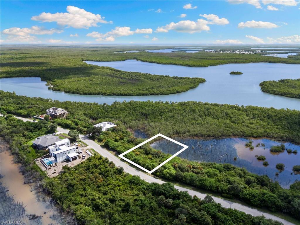 For the buyer who wants something different from the typical Marco Island homesite, this is an opportunity to build a one-of-a-kind home surrounded by nature, history, boating and the quiet beauty of Key Marco. Encompassing 546 acres with 375 acres designated as a nature preserve, Key Marco offers spectacular panoramic water views, access to luxury facilities, and unmatched privacy for its residents.
This oversized .63-acre homesite offers approximately .30 acres of uplands and .33 acres of wetlands, creating a lush natural setting and buffer around your future custom home. Design a 3000 square foot or larger residence that rises into the landscape, with the potential for up to 55 feet above the first floor grade, subject to applicable approvals, capturing elevated views across serene waterways, native preserve and toward the Gulf. Here, your home will feel immersed in nature rather than surrounded by neighboring rooftops.
Key Marco offers lush landscaping and exceptional privacy while remaining just minutes from Marco Island's beaches, dining and everyday conveniences. Owners enjoy access to the community marina with direct (no bridges) boating access to the Gulf, along with clubhouse amenities, fitness facilities, tennis, pickleball, fishing areas and scenic paths.
Rich in history, Key Marco has significant archaeological sites documenting thousands of years of human habitation. Gopher tortoises, burrowing owls, roseate spoonbills and abundant native wildlife remain part of the landscape today.
Rarely does a Marco Island homesite offer this combination of privacy, natural beauty, boating access and the freedom to create something truly distinctive.