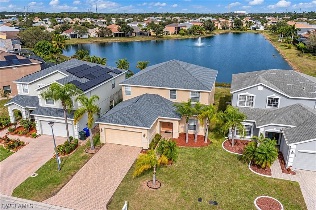 Enjoy spacious living and peaceful lake views in this two-story home offering approximately 3,260 square feet, 5 bedrooms, and 3.5 bathrooms. The open floor plan connects the kitchen, living, and dining areas, creating an inviting space for everyday living and entertaining. The first floor features two bedrooms and 1.5 bathrooms, while upstairs offers two additional bedrooms, a full bathroom, and a spacious primary suite with an expansive walk-in closet. A large den and separate office/game room provide flexibility for working from home, hobbies, or additional gathering space. Jack-and-Jill bathroom access adds convenience to the layout. Relax on the screened patio overlooking the lake and enjoy a roof replaced in December 2023. Low HOA fees and a convenient location near shopping, dining, major highways, and the airport complete the appeal.