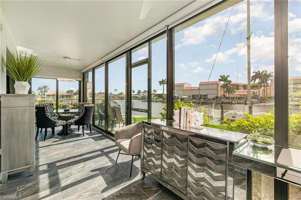 Exceptional Waterfront Living with Direct Gulf Access — Dock Space available with board approval! This residence presents an exceptional value and a rare opportunity for buyers seeking a refined waterfront lifestyle. This motivated seller is offering an extraordinary chance to experience luxury, comfort, and direct Gulf-access living in a beautifully updated 3-bedroom, 2-bath end-unit residence with 1,733 square feet of thoughtfully designed living space. The open-concept layout is ideal for both entertaining and everyday relaxation, while the fully renovated interior showcases modern finishes throughout. The chef-inspired kitchen features quartz countertops, under-cabinet lighting, and premium stainless steel appliances. Both bathrooms have been tastefully updated with quartz finishes, while the primary suite offers a spa-like retreat complete with a luxurious roll-in shower. As a desirable end unit, the home is filled with natural light from multiple hurricane-impact windows and sliding doors. The oversized east-facing lanai captures serene waterfront views, creating the perfect setting for morning coffee, quiet evenings, or simply enjoying the Florida lifestyle. Ideally situated near Jaycee Park and close to Publix, dining, shopping, and waterfront recreation, this residence offers an exceptional opportunity to own a beautifully updated Gulf-access condo in a sought-after location.