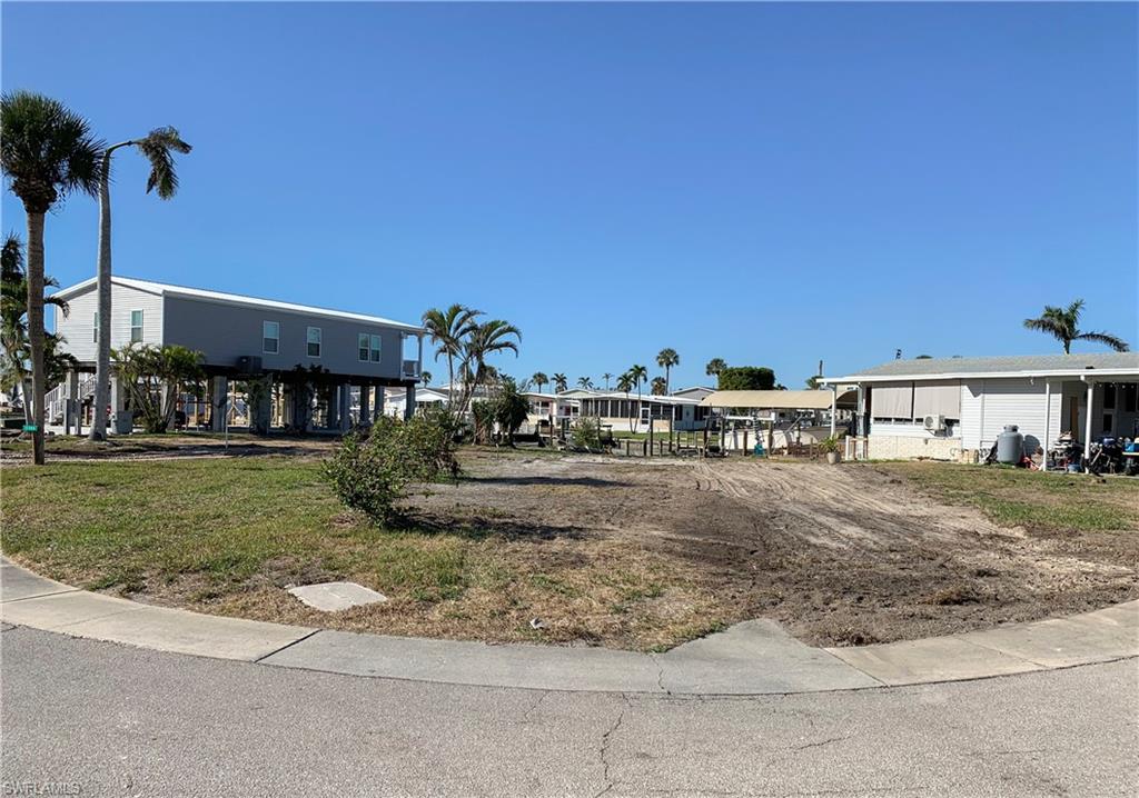 PRICED TO SELL! Large corner lot available in Bayside Estates with DIRECT GULF access. New Seawall in 2009, this lot offers added value and peace of mind! This lot has plenty of room to accommodate a pool home with a garage. Just a short boat ride, or bike ride to FMB. Bayside Estates is a sought-after 55+ boating community close to everything that's fun in the sun. We have the expertise and resources to help you build your dream home in paradise.
From trusted builder introductions to financing options, insurance providers, and more — we’re here to guide you every step of the way. Amenities include, Bocce court, Clubhouse, Community pool, Community room, Exercise room, Internet access, Library, Pickleball, Shuffleboard, Sidewalk, Tennis Court, Underground utility. Maintenance includes, Internet, Irrigation, Lawn/Land, Manager, Rec Facilities, Sewer, Street lights, Trash removal and water. The community Clubhouse & Office now have a water barrier planking system up to 31” High & Cool Seal waterproof insulated paint. HOA fees are $700 a quarter. Buyers pay a $2800 capital contribution fee .
