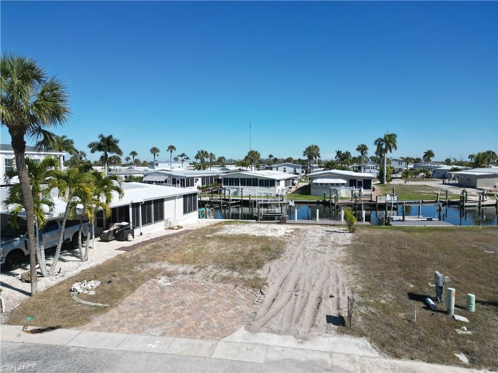 This is one of the most reasonably priced vacant lots in Bayside Estates. Others may be similarly priced, but they probably don’t include a boat lift or dock. That alone is worth a good chunk of change. So, if you are in the market for a vacant lot to put your new manufactured home on and begin enjoying all Bayside has to offer, this may be just what you have been looking for. This lot is centrally located within the park so getting to your friend’s house for dinner is easy no matter what direction they might live. Manufactured homes have come a long way in the last decade or so and most people can’t tell the difference from a stick-built home once they step inside. All current models are engineered to meet new standards and the quality is impressive. Go shopping and pick out the manufactured home that suits your needs and have it installed on your new lot. Bayside Estates is the best kept secret of Fort Myers Beach. This incredibly active and friendly 55+ community is the crown jewel on the gulf coast. Bayside estates is only 2.5 miles to the beach and is accessible by either car or boat--right from either your driveway or private boat dock. A very popular activity is to ride your electric bicycles to the beach for the day and visit the world-famous Jimmy Buffett’s Margaritaville. Just don't step on a pop-top!! Nearly all the major retail vendors are within a very short driving distance for ultimate convenience. For those who don’t know a lot about Bayside Estates, it is a very fun place to call home---some would even say it’s a mature person’s playground. Whether you want to play pickleball, tennis or bocce ball, hang out at the community pool, or simply cruise the hood in your swanky golf cart, there is always something going on around here. People are friendly and you will be warmly welcomed.