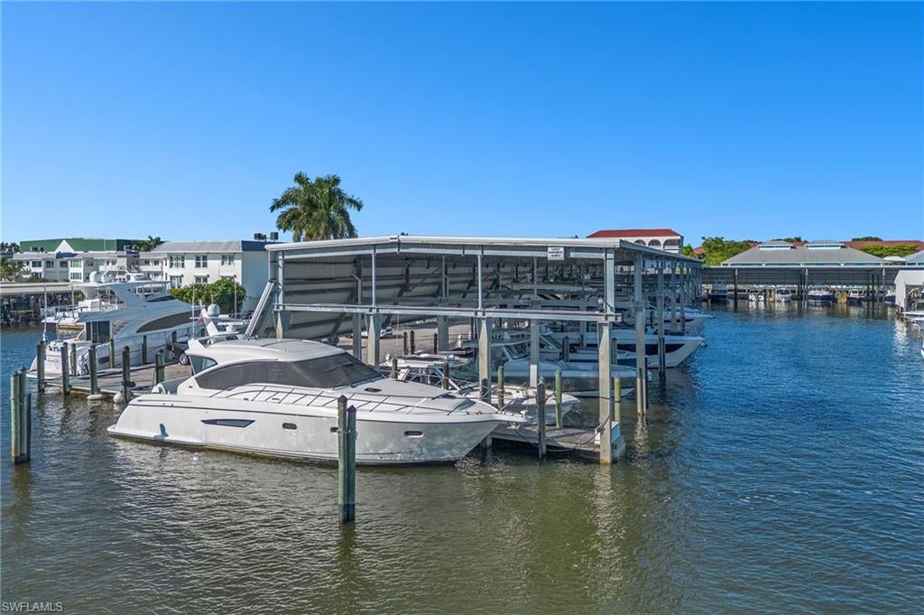 An Exceptional Boat Slip Opportunity in Downtown Naples - Powerboat Squadron Marina brings together a distinctive combination: direct Gulf access with no bridges, an Old Naples waterfront setting, and restaurants and shopping within a short distance. Slip 62 offers an opportunity to make this boating lifestyle your own, with an unusually wide adjoining submerged parcel measuring approximately 73 feet by 30 feet. Powerboat Squadron’s amenities include controlled-access gates, 24/7 dockmaster staffing, a marina office, restrooms, ice, laundry facilities, and parking right next to the boat slip. Close to Tin City’s waterfront shops and restaurants or explore Fifth Avenue South’s dining, boutiques, and galleries. Nearby dining choices include Riverwalk at Tin City, Sea Monkey Tavern & Grill, and The Syren Oyster & Cocktail Bar. The boat slip must be sold together with a gorgeous 2010 Tiara Yachts 5800 Sovran for an additional $599,000.