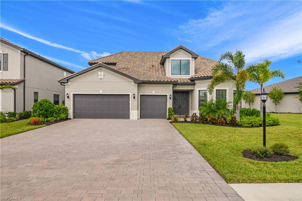 WELCOME HOME TO PARADISE in this STUNNING STONEWATER WITH A LOFT MODEL by Pulte!! Offering an unparalleled blend of luxury, space, and resort-style living in The Place at Corkscrew. Boasting an expansive residence of 3,876 under air featuring 4 Bedrooms, 4 Bathrooms, a Private Den, a Loft, AND INCLUDES A GOLF CART, 3-car garage, 9-car driveway, and one of the most impressive custom outdoor living spaces in The Place at Corkscrew!! The open-concept layout showcases 12-foot ceilings, coffered ceilings, crown molding, wood grain tile flooring, 5 panels of sliding glass doors to the exquisite outdoor oasis! The gourmet kitchen anchors the home with a custom walk-in pantry and butcher block countertop, oversized island, waterfall quartz, custom bar and cabinetry, designer lighting, eat-in kitchen, formal dining space, and each bedroom has their own private entrance providing the ultimate living space for everyone. A thoughtfully designed split-bedroom floor plan provides privacy, with the primary suite offering a spa-inspired bath and generous walk-in closet. A private den with French doors serves as an ideal home office or flex space. Zoned air conditioning adds comfort and efficiency throughout. The second level features a loft living area with a media room, 4th bedroom and full bathroom, creating an ideal retreat for guests, extended family, or multigenerational living. Outdoor living is a standout, featuring a custom outdoor kitchen and living room, a heated pool and spa, expansive covered lanai, privacy shades, and a fully fenced backyard, perfect for year-round enjoyment. Residents enjoy resort-style amenities including a resort pool with 100' waterslide, two waterfalls, cabanas, poolside food and beverage service, 40-person spa, an adult only bourbon bar, café and marketplace, pickleball courts, tennis courts, basketball, bocce ball, a two-story fitness center, and a full social calendar. Conveniently located near shopping, dining, beaches, and RSW International Airport.