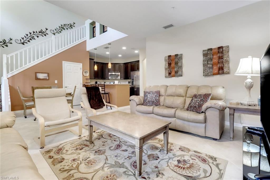 HUGE Price Improvement!  Beautifully appointed and ideally located on a sought-after Quad, this upgraded Santa Isabella floor plan offers the perfect blend of luxury, comfort, and convenience—just steps from Town Center.
From the moment you enter, you’ll appreciate the soaring ceilings and thoughtfully designed living spaces. The home features upgraded cabinetry, a stylish mix of tile and laminate wood flooring, and a striking staircase with decorative tile risers. The gourmet kitchen is fully equipped with stainless steel appliances, level 4 cabinets, ample storage, and a spacious walk-in pantry—perfect for both everyday living and entertaining.  The open-concept living and dining area provides a welcoming space to gather, while generously sized upstairs bedrooms and bathrooms ensure comfort and privacy. An additional built-in desk/loft area offers the ideal setup for a home office or study space. A single-car garage adds convenience and extra storage.  

Step outside and enjoy one of Ole’s signature semi-private Quads, just steps from your door, featuring a resort-style pool, grilling stations, and a relaxing lounge area surrounded by lush Florida landscaping.  A short stroll along the beautiful, fountain-lined boulevard leads you to Ole’s vibrant Town Center, where you’ll find a pub, bistro, fitness center, movie theater, library, and business center. Continue on to experience one of the most stunning resort pools in Lely Resort—complete with swaying palms, a spa, and recreational options including bocce ball and volleyball.  

Ole is nestled within the highly desirable Lely Resort community, home to two public golf courses and one private course. You’re also conveniently located within half a mile of shopping, dining, entertainment, and grocery stores.  Enjoy the best of Southwest Florida with downtown Naples’ renowned 5th Avenue—featuring world-class shopping, dining, and beaches—just under 9 miles away. Or head in the opposite direction to Marco Island, also about 9 miles away, for breathtaking beaches and coastal charm.  This home truly offers it all—luxury, location, and lifestyle.  All that’s missing is you!