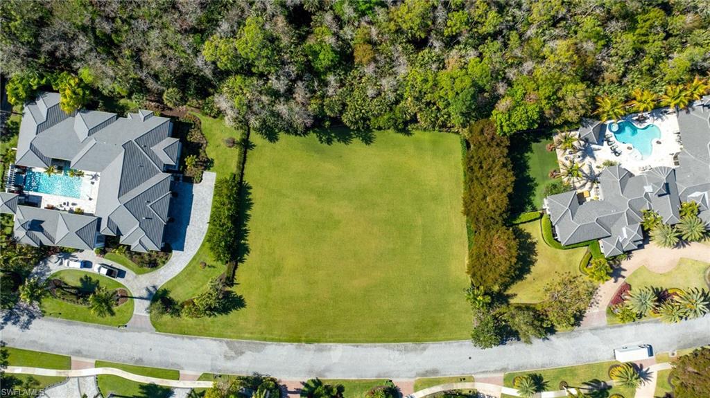 BRING YOUR OWN BUILDER to the ONLY available homesite in Quail West. The existing home has already been demolished and provides 1.05 acres of coveted southwest exposure. Design your own custom home of at least 3,000 square feet or choose between two floor plans meticulously crafted by legendary architect RG Designs to significantly expedite the building process for you by up to 6 months. The plans that have been sited on this rarely available estate lot are a 4,500 sqft and 5,800 sqft plan. Plan # 1 is 4,500 sqft under air with 4 bedrooms, study, and 6 bathrooms.  Plan #2 is 5,700 sqft under air featuring 5 bedrooms, study, and 7 bathrooms. This homesite borders a never to be developed 100-acre nature preserve providing the utmost privacy while still being in close proximity to the club house and all the amenities’ Quail West has to offer. Enjoy two Arthur Hill designed golf courses, a recently renovated 100,000 square foot clubhouse with a variety of dining options, racquet sports complex, and a two-story fitness center.  Quail West is one of the most exclusive golf communities in all of Florida and has recently earned the prestigious Platinum Club® status—an honor reserved for the top 1% of private clubs worldwide. Not to mention, Quail West is centrally located giving you endless opportunities to enjoy all of what Southwest Florida has to offer. Just fifteen minutes to the Gulf of America, twenty minutes from RSW international airport, and a thirty minute drive to downtown Naples. Plans are available upon request. The Listing agent has builder contacts who have bid out the plans mentioned above with pricing starting at $550 price per square foot! This listing contains virtual renderings of both available floor plans.