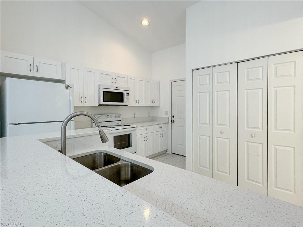 Experience the best of Naples living in this charming first-floor attached villa featuring 2 bedrooms and 2 bathrooms. Vaulted ceilings create a bright, open atmosphere, while updated laminate flooring adds warmth and style throughout the main living areas. Enjoy peaceful mornings and stunning western sunset views from the screened lanai overlooking beautifully landscaped grounds.

Located in a quiet residential community, this home offers the perfect blend of comfort and convenience just minutes from Olde Naples, downtown dining and shopping, and the pristine beaches of the Gulf of Mexico. Vista Gardens provides an exceptional opportunity to enjoy the Naples lifestyle at an incredible value.