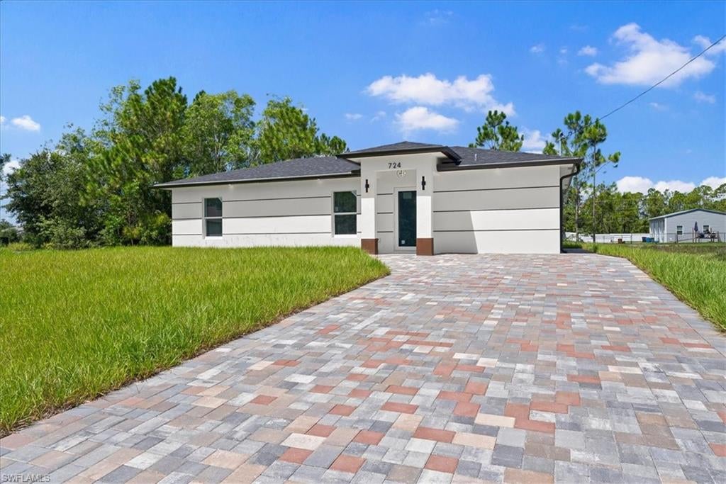 CLOSING COST ASSISTANCE AVAILABLE! Step inside and you’ll immediately feel the difference a thoughtfully designed new home can make. This modern open-concept layout creates an easy flow between the living, dining, and kitchen areas, making everyday life and entertaining feel effortless. The split-bedroom design gives the primary suite its own sense of privacy, complete with a walk-in closet, while the additional bedrooms offer flexibility for guests, a home office, or a growing family. Tile flooring throughout makes the home stylish and incredibly easy to maintain, while impact-resistant windows and a tankless water heater add comfort, efficiency, and peace of mind. Outside, the spacious yard gives you room to create the outdoor space you’ve been wanting—whether that’s a pool, patio, play area, or your own private retreat. With no HOA and a paved road, this is the kind of home that makes moving into new construction feel simple. Come see it in person—you may be surprised by how much this home has to offer.