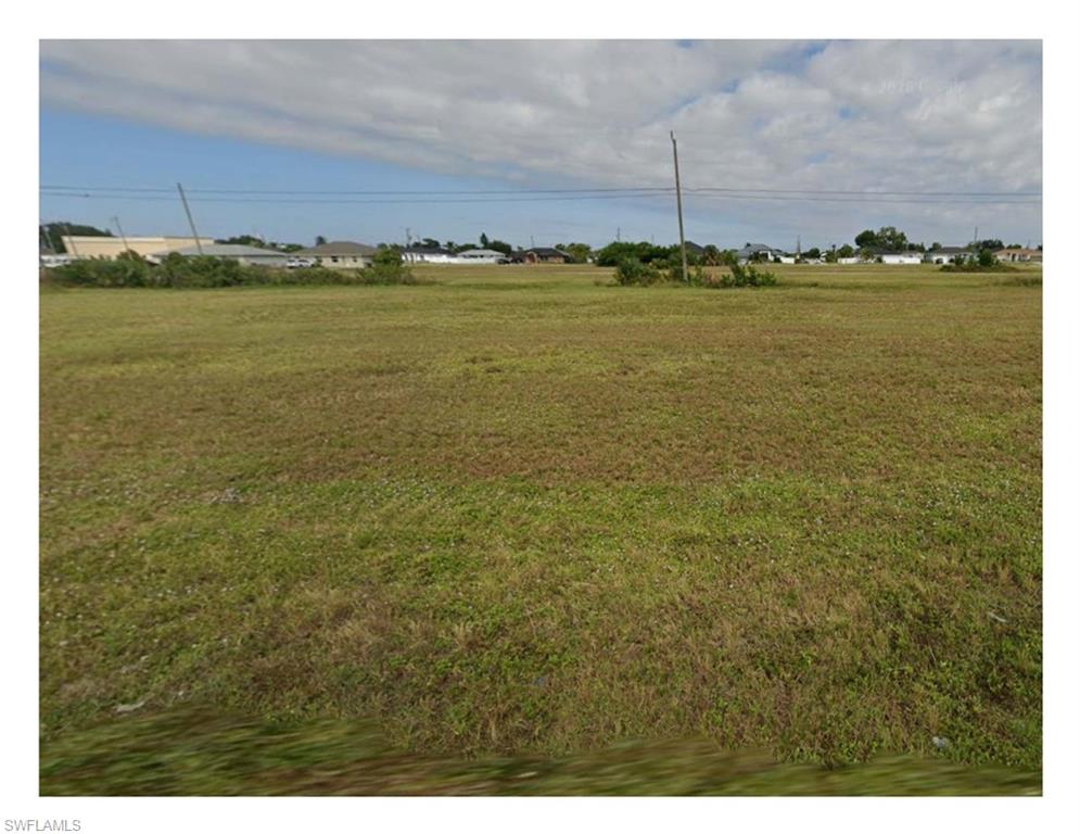 Great buildable commercial lot within the Cape Coral Pine Island Road District.  Zoned Corridor, a range of commercial uses are permitted including:  office, flex office warehouse, medical, retail and community facilities.  Centrally located, the property is fully served by City water, sewer and irrigation and connects to both Andalusia and Del Prado for quick access to and from Pine Island Road and surrounding roadways.  Property is grassed and cleared, ready to develop.