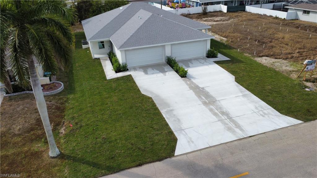 Pre-Construction Duplex Opportunity in Central Cape Coral! Lock in two spacious 1,402 sq. ft. (under air) 3-bed, 2-bath units, each featuring a 2-car garage. Designed to maximize your ROI while keeping future operating costs low, these thoughtfully value-engineered homes are packed with high-end, durable upgrades. Full impact-resistant windows and doors. Luxury Finishes: Level 3 granite and quartz countertops throughout, LED lighting, and ceiling fans in every room. Spacious Living: Volume ceilings in main living areas, oversized kitchens with full walk-in pantries, and dedicated walk-in laundry rooms. Located in a highly desirable, central location, this property is perfect for savvy investors or owner-occupants looking for premium quality and massive rental appeal. Buy with confidence—financing is available with just 3-5% down!