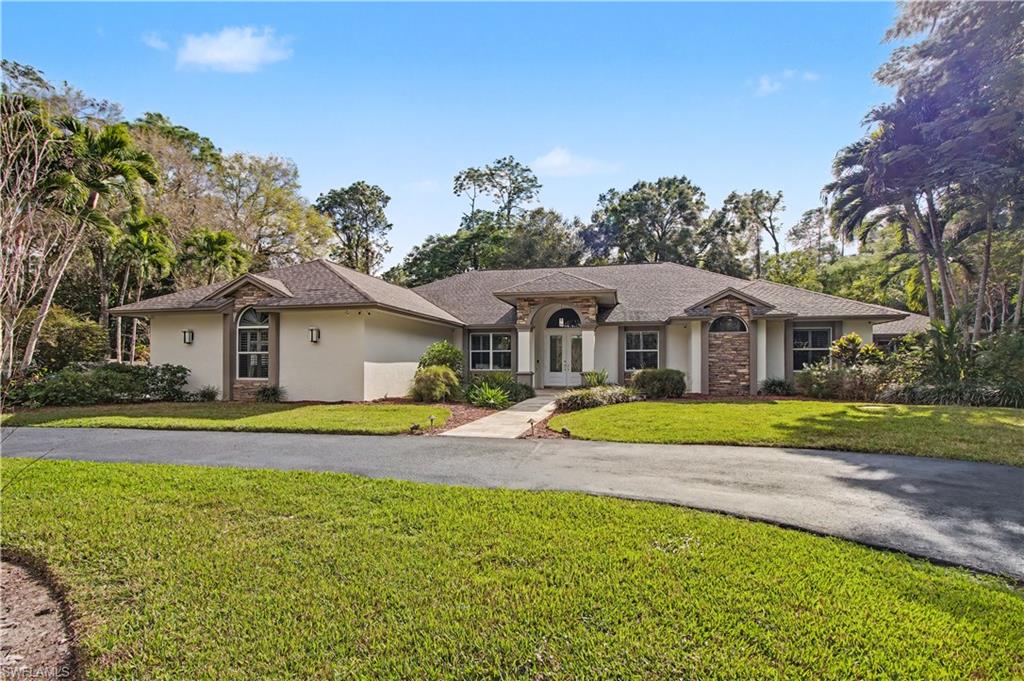Exceptional estate offering 4 BEDROOMS, 2 DENS, and 4 BATHROOMS, set on 2.73 ACRES in the highly desirable LOGAN WOODS area, ideally located in the heart of the city while still offering privacy and space. This expansive residence is designed for elevated living with generous proportions and a layout that feels open, welcoming, and seamlessly connected throughout. Interior highlights include a FULL THEATER ROOM with MOTORIZED RECLINING SEATING FOR SIX, a striking CUSTOM LIT GLASS ART FEATURE, a FIREPLACE, CENTRAL VACUUM SYSTEM, SECURITY CAMERA SYSTEM, INDOOR WET BAR, and a WHOLE-HOME REVERSE OSMOSIS WATER SYSTEM. The PRIMARY BATHROOM is beautifully appointed and includes a BIDET, while everyday functionality is enhanced by an IN-HOUSE LAUNDRY ROOM and an OVERSIZED TWO-CAR GARAGE. One of the dens can easily be converted into an additional bedroom, offering flexible living options. A PRIVATE IN-LAW SUITE provides excellent versatility for guests or multigenerational living without disrupting the home’s overall flow. Outdoor living is truly resort-inspired, featuring a HEATED POOL AND SPA within a SCREENED ENCLOSURE, a SECOND SCREENED PATIO offering additional shaded lounge space, and an OUTDOOR SHOWER. Entertain effortlessly in the OUTDOOR KITCHEN set beneath a GAZEBO with a GAS COOKTOP, or gather around the PAVERED FIRE PIT AREA for evenings under the stars. The property is beautifully landscaped with an AUTOMATIC SPRINKLER SYSTEM and includes a STORAGE SHED for added convenience. Offering acreage, luxury amenities, and a prime central location with no HOA restrictions, this home presents a rare opportunity to enjoy estate living without sacrificing convenience.