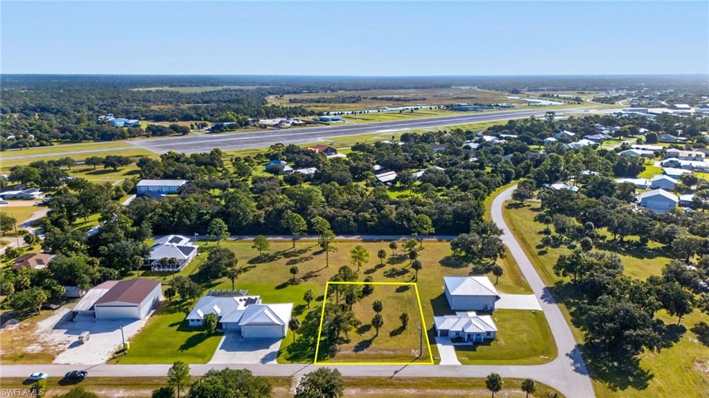 ATTENTION PILOTS ! Looking for a unique place to build your dream home and hangar? Located in a private aviation community, this lot offers a rare opportunity to live among fellow aviation enthusiasts. Stop paying hangar rent at the airport! This community is perfect for those who love to fly. Own a piece of history, Buckingham Army Airfield was a WW II gunnery training facility. The airfield occupied over 7000 acres and had 6 runways. There is nothing better than being able to walk from your home into your own hangar! A quick preflight and a short taxi through the gates of FL-59 and you are able to fly anywhere! FL59 is 4500'x400' with overruns. The annual HOA fee is only $300!