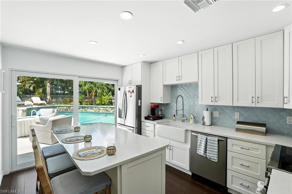 Lakewood Park Living at Its Best — Style, Sunshine & Investment Potential!

Fresh, stylish, and full of personality, this beautifully updated 3-bedroom, 2-bath home in sought-after Lakewood Park is ready to impress! Step inside to discover a chef-inspired kitchen, modern LED lighting, stylish shiplap accents, and custom built-in cabinetry in the dining room that adds both character and functionality. Thoughtfully updated and designed for comfortable living, this home offers a warm, inviting feel with the modern touches buyers love.

Outside, the beautifully landscaped, fenced yard creates a private tropical escape, complete with a sparkling pool and spa that set the stage for unforgettable parties, family gatherings, and relaxing afternoons in the Florida sunshine.

Even better, this home can be purchased fully furnished and ready to go, making it an exciting opportunity for investors seeking a potential rental property or buyers looking for a turnkey Florida getaway. Just bring your suitcase and start enjoying the lifestyle!

Conveniently located near shopping, dining, and Naples’ beautiful beaches, this Lakewood Park gem delivers the perfect combination of style, outdoor living, and flexibility.

Beautifully updated. Turnkey optional. Poolside living included. This is one you won't want to miss!