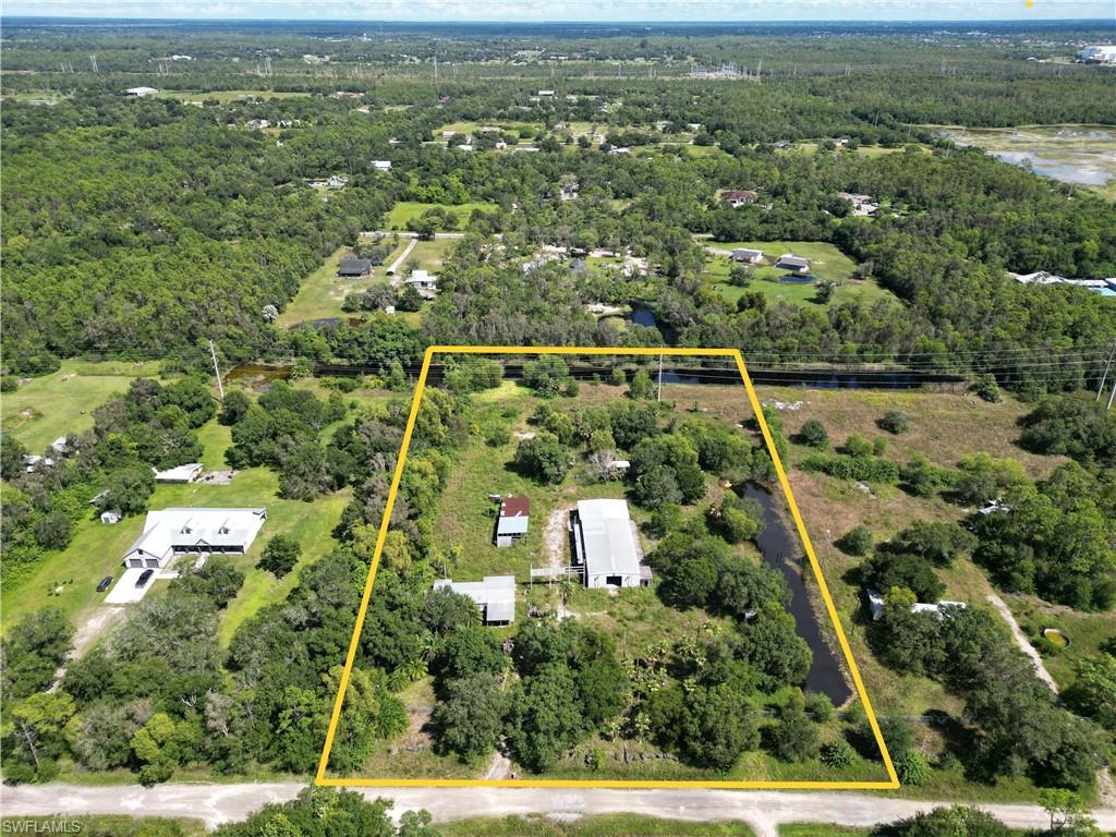 Discover country living at its finest on one of the highest and driest lots in the area. This three-bedroom, three-bathroom manufactured home offers solid bones and exciting renovation potential for those with vision. The property features a separate massive steel warehouse spanning 3,040 square feet, complete with hydraulic lift and electricity—perfect for workshops, serious storage projects or running a business from home.
Agricultural zoning means no deed restrictions, giving you the freedom to live life on your terms whether farming, or doing business. The fully fenced property includes a barn with steel roofing for additional storage or livestock needs. Chain link fencing ensures security and privacy.
Outdoor enthusiasts will appreciate the deep lake stocked with bass, ideal for peaceful fishing mornings. Located conveniently near Buckingham Community Park and local shopping, this unique property combines rural tranquility with practical amenities. Whether you're seeking a renovation project, business opportunity, or simply want to escape to peaceful country surroundings, this property delivers exceptional value and potential.
SELLER FINANCING AVAILABLE makes this countryside retreat even more attainable.