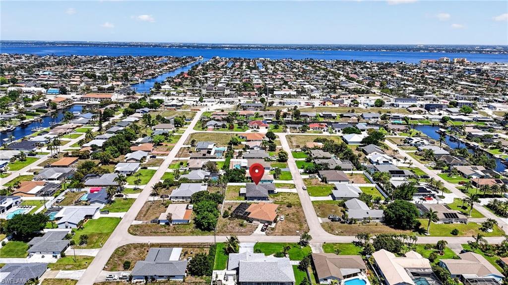 Beautiful 3 Bedroom, 2 Bath Home in the Heart of Cape Coral!
Located in desirable Zone X500 – No Flood Insurance Required, No HOA, this well-maintained home offers both peace of mind and everyday comfort. The spacious kitchen features granite countertops, a convenient breakfast bar, and plenty of room to inspire any home chef.
Enjoy a thoughtfully designed layout featuring a formal dining room—perfect for bringing out the china and hosting memorable gatherings, a large laundry room, and ceiling fans throughout. The private primary suite offers a generous walk-in closet granite counters and dual sinks for added comfort and convenience.
Step outside to your screened-in patio, ideal for relaxing evenings or entertaining guests. The backyard provides plenty of space to design your dream pool, adding exceptional value. 
Assessments Paid! Dual A/C  units for peace of mind(2021)
Ideally located near beaches, shopping, dining, hospitals, and local marinas, you’ll enjoy both convenience and the vibrant Southwest Florida lifestyle.
Don’t miss your opportunity to own your own piece of paradise—schedule your private showing today!