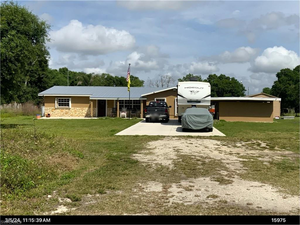 Seller is motivated and will consider all offers from qualified Buyers! 
Escape the noise and step into your own private slice of country living in LaBelle, Florida. This versatile property is perfect for anyone looking to start a farm, create a homestead, or simply enjoy wide-open space while still being conveniently close to everyday essentials like shopping, banks, and local restaurants. The land is thoughtfully set up for rural use, featuring divided pastures ready for livestock and a massive barn ideal for housing farm animals, equipment, or feed. Whether your're raising animals or planning a hobby farm, this property gives you the space and flexibility to make it your own. A standout feature is the large workshop, complete with a car lift-perfect for mechanics, car enthusiast, or running a home-based business. In addition, two storage containers provide plenty of extra space for tools, equipment, or supplies. When it's time to relax, enjoy the huge in-ground pool-ideal for cooling off on warm Florida days or entertaining friends and family. The expansive concrete driveway offers ample parking for vehicles, trailer, RVs, or farm equipment. This property truly offers the best of both worlds: peaceful rural living with the convenience of town just a short drive away. Opportunities like this don't come around often-bring your vision and maike it yours!