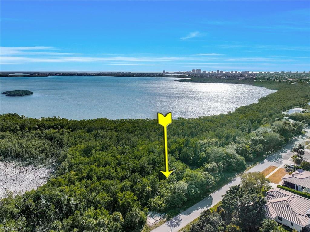 Build your dream home with the option to use a multi-story home layout to enjoy HUGE BAY VIEWS. This lot offers Southern Exposure, so you will see the Sunrise all the way to Sunset. This is a low-traffic area, so Nature and Serenity are at your fingertips while still being close to everything that brings you to Marco Island. Shopping, grocery and restaurants are nearby and you are only around a mile to Marco Island's white, sandy Resident's Beach! Don't miss this great opportunity to start building your NEW ISLAND home today.