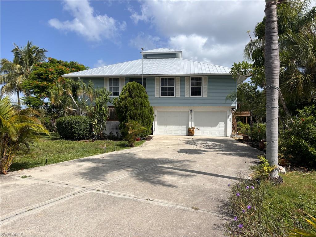 Elevated two Story piling home with over 1,700 sq ft under air and large 4 car enclosed garage on 1st level.   Huge workshop area.  
Pine Island and Bokeelia offer small-town charm, art galleries, local markets, Tree Nurseries and some of Southwest Florida’s best fishing and boating. Whether you’re seeking a primary residence or vacation home.
Home offers 3 bedrooms and 2 baths with large living area.  Large back (screened) deck and outside grilling entertaining deck with stairs.
Very private backyard with pathway around the golf course.  Newer air, galvanized roof, most windows are
hurricane proof, new hot water heater, new soffit and rain gutters.   New flooring throughout the home.
You can walk to Pineland Marina which offers full Marina Service, dine at the well-known Tarpon Lodge.
Private setting.  You will love this Island and community.