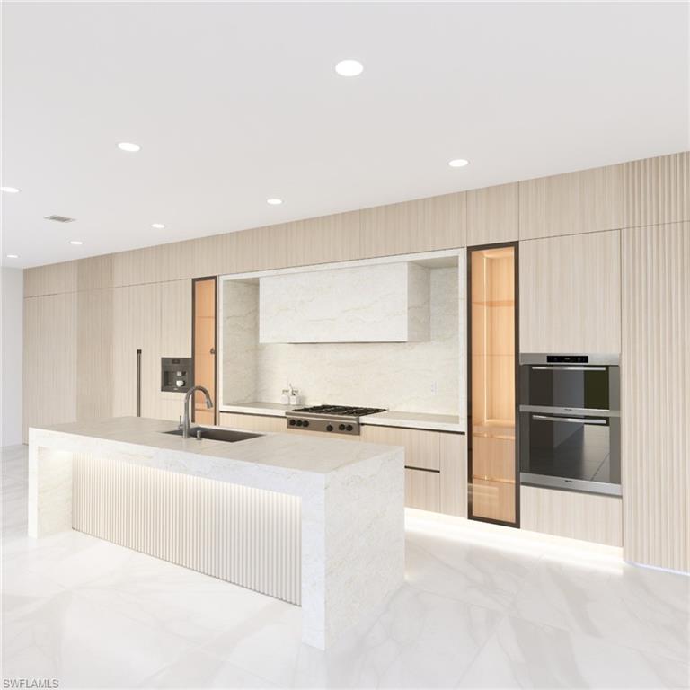 Luxury is rising on the coveted south end of Fort Myers Beach, where this 7-bedroom, 7-bath all-concrete waterfront showpiece—expected to be completed this fall—is set to become one of the most ambitious new homes on the island. Designed for both resilience and refined coastal living, the home features expansive walls of glass, oversized sliding doors, and multiple terraces that capture natural light and water views from nearly every level.

Located directly on a deep-water canal with quick Gulf access, the property is ideal for boating enthusiasts and will feature a private boat lift and double jet ski lift for effortless days on the water.

The interiors showcase a modern architectural aesthetic with 48” x 48” porcelain flooring throughout the main living areas, dramatic 60” x 120” Italian porcelain in the primary bath, porcelain and marble finishes in secondary baths, quartzite countertops, and Level 5 smooth wall finishes. The chef’s kitchen will be equipped with a fully integrated Miele appliance package, including panel-ready refrigerator and freezer columns, 48” gas cooktop, oven, steam oven, microwave, and built-in coffee system. Additional highlights include two coffee stations, four high-efficiency Carrier HVAC systems, three tankless water heaters, integrated sound, CCTV security, and an oversized elevator servicing the main living levels.

Outdoor living centers around a spectacular 12’ x 40’ infinity-edge saltwater pool and spa with Pentair heating and automation, creating a private resort-style setting.

The rooftop plaza deck offers breathtaking 360-degree views of the Gulf, Estero Bay, and the island skyline, providing a rare elevated outdoor living space perfect for sunset entertaining.

Buyers who secure the property during construction may have the opportunity to participate in the final finishing selections, allowing for personalization of this exceptional residence.

Positioned directly on Estero Boulevard, the property also offers excellent vacation rental potential, with its seven-bedroom layout, luxury amenities, and prime south-end location making it a strong candidate for high-income producing rentals.