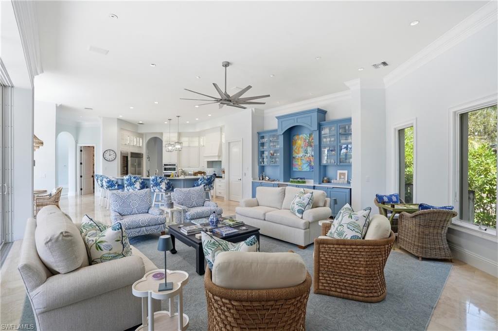 An extraordinary offering in the prestigious enclave of Collier’s Reserve—this is one of only six riverfront residences with direct Gulf access. Perfectly positioned along the water, this estate blends timeless elegance with extensive modern upgrades, creating a refined coastal retreat. The refreshed exterior features whole-house painting and new landscaping, enhancing curb appeal. Inside, the home has been thoughtfully reimagined with a redesigned staircase, updated LED lighting with Lutron controls, and a newly installed security system. Home generator for peace of mind. Architectural details have been thoughtfully refined to enhance flow and create a more elevated, contemporary aesthetic. Offering four bedrooms, four full baths, a den, and a powder room, the residence balances comfort and sophistication. The primary suite features plush wool carpeting, custom window treatments, bespoke closets, and a fully renovated spa-inspired bath. Guest suites have been updated with new carpeting, designer wall coverings, custom cabinetry, and curated furnishings. The study showcases custom paint and Phillip Jeffries wall coverings. Entertaining spaces include a dining room with custom sisal rug and a fully renovated powder room. The kitchen has been expertly updated with custom-painted cabinetry, Sub-Zero wine column, illuminated glass cabinetry, updated backsplash, and bespoke pantry. The great room features a custom built-in with ice maker and sink. Additional highlights include a fully renovated laundry room with Electrolux appliances, custom cabinetry, added sink and counter space, and a spacious four-car garage. Offered furnished with designer-curated interiors for a turnkey experience. Enjoy serene riverfront living with direct Gulf access and an immediate golf membership. Collier’s Reserve offers a championship golf course, tennis, pickleball, fitness center, dining, boating, kayaking, and scenic trails.