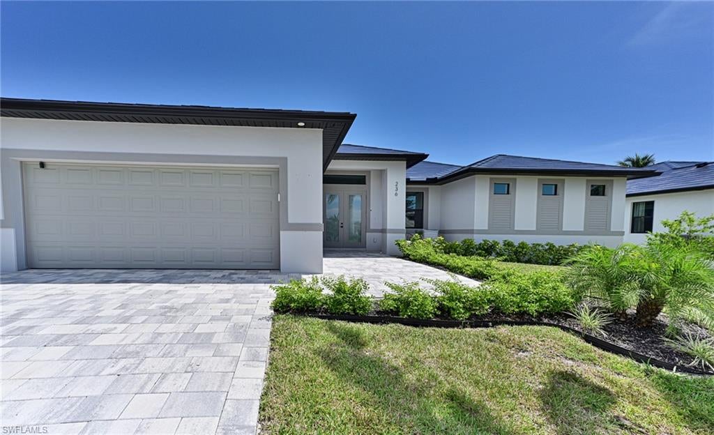 This 2025 new construction 4 bedroom waterfront home offers it all including: perfect Collier County location in Little Hickory Shores on a wide canal, walk or bike to beautiful Barefoot Beach, premier boating out your back door via a new covered dock, lift and composite decking with no bridges and quick gulf access, southern exposure, light coastal design inside and out, open floor plan and designer selections throughout, but best of all is PEACE OF MIND with a Tesla roof and battery pack so no generator or propane tanks and lines to worry about and no electric outages, concrete construction to the latest hurricane codes including impact windows and doors and the whole house including the garage and pool were constructed at an elevation above FEMA requirements so flooding is not an issue all while constructed on one level for ease of living. Features include great room, kitchen and dining all open to covered lanai leading to the swimming pool and deck area all overlooking the water and boat dock, volume & vaulted ceilings, large kitchen with island, pantry, quartz countertops custom double stacked Kitchen cabinetry, porcelain wood plank flooring, 8’ doors, smooth drywall finish and designer bath selections. The elevated pool with sundeck includes an oversized covered patio with access to a convenient pool bath. The spacious master suite offers 2 walk in closets with built-ins, oversized frameless shower and floating tub with dual vanities and the 3 guest rooms include an additional en-suite bath. The oversized garage also above flood is finished with epoxy flooring. Little Hickory Shores is centrally located to dining, entertainment, golfing, arenas in Naples and Bonita Springs and is close RSW Airport, the Promenade, Coconut Point, Mercato & Waterside Shops and Old Naples. There is also an option to join the Club at Barefoot Beach which offers casual and fine dining restaurants, pool & beachside food, drinks and chair service, indoor & outdoor bars, tennis courts with pro & a full events calendar. (waitlist with usage during wait period). Note: This property is a perfect full time homestead residence or winter home residence with no worries while away during the summer, a come and go property that earns enough to carry itself when you are not in residence or a full time rental property since no rental restrictions and no HOA fees. Designer turnkey furniture and furnishings package can be purchased for $99,900