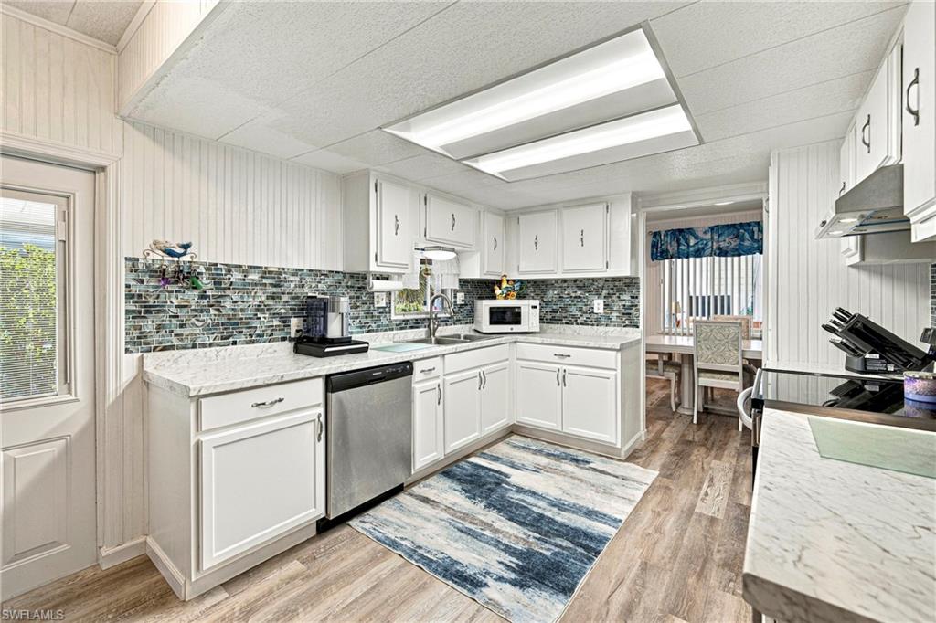 WELCOME TO THE FLORIDA LIFESTYLE IN OLD BRIDGE VILLAGE! This beautifully remodeled, furnished 2-bedroom, 2-bath manufactured home is located in the desirable 55+ waterfront community of Old Bridge Village in North Fort Myers. Step inside and discover a bright, welcoming interior featuring luxury vinyl flooring, a spacious living area, and a beautifully appointed kitchen with crisp white cabinetry, stylish tile backsplash, generous counter space, and stainless steel dishwasher. The comfortable living room offers plenty of space for relaxing or entertaining, while sliding glass doors lead to a wonderful enclosed Florida room filled with natural light. Surrounded by windows, this charming additional living space is perfect for enjoying your morning coffee, reading a good book, or gathering with friends and family. Offered furnished, this home makes settling into the Florida lifestyle easy! Whether you're searching for a seasonal getaway or a year-round residence, this inviting home is ready for you to make it your own. Old Bridge Village is an active 55+ waterfront community offering recreational amenities, social activities, and access to the beautiful Caloosahatchee River. Conveniently located near downtown Fort Myers, shopping, dining, and entertainment. Pack your bags and start enjoying the sunshine, waterfront lifestyle, and wonderful sense of community that make Old Bridge Village such a special place to call home!