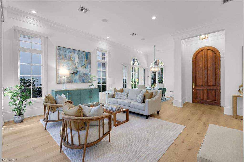 Skip the waitlist and go directly into the exclusive lifestyle of The Colony Golf & Country Club. This beautifully updated three-bedroom, three-and-a-half-bath villa offers the rare, desired advantage of immediate golf membership eligibility (subject to club approval and fees). Set within the prestigious, gated enclave of Pelican Landing, the Las Palmas neighborhood evokes the romantic charm of a European coastal village, complete with cobblestone streets, intimate courtyards and classic Mediterranean architecture. From the moment you step inside, soaring 14-foot ceilings, 12-inch moldings and graceful arched windows establish an immediate sense of architectural distinction. Natural light floods the residence, illuminating gorgeous French oak flooring, a fresh neutral color palette, and thoughtfully curated furnishings that seamlessly blend contemporary flair with timeless character. At the heart of the home is a fully updated, eat-in chef’s kitchen. It features crisp white cabinetry, premium stone countertops and a suite of high-end appliances, including a professional 48-inch Miele gas range, a Miele dishwasher and a Thermador refrigerator. The sophisticated updates continue into the baths, which are adorned with sleek quartz countertops, modern lighting and stylish ceiling fans throughout. No detail has been overlooked in modernizing this residence while preserving its original architectural integrity. Comprehensive recent improvements include a new roof in 2026, custom window shades, Premium French oak flooring, plush new carpeting, fresh interior paint throughout, new high-efficiency washer and dryer, and upgraded kitchen appliances. The luxury experience seamlessly extends outdoors. Beyond the main living spaces, a private pool and spa overlook a tranquil pond, creating a serene backdrop for relaxation and lively entertaining. Living at The Colony at Pelican Landing opens the door to an unparalleled array of world-class recreational and social amenities. Residents enjoy exclusive access to a private beach pavilion, tennis, pickleball and bocce courts, attended fitness center, scenic kayak parks and sailing facilities. The Bay Club, an exclusive, private dining destination reserved strictly for Colony residents, offers exquisite waterfront dining and a vibrant social scene. Conveniently just minutes from pristine Gulf beaches, upscale shopping, fine dining and Southwest Florida International Airport, this fully furnished Las Palmas villa ideally pairs European architectural romance with modern luxury. Turnkey and ready for its next chapter, this home is your gateway to the distinctive Colony lifestyle.