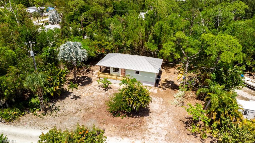 BACK ON THE MARKET- BUYER GOT COLD FEET!

Welcome to your slice of true island living in beautiful Bokeelia. Nestled on a quiet street just minutes from Pineland Marina, this charming coastal cottage offers the laid-back lifestyle Southwest Florida is known for—where fishing days are long, sunsets are unforgettable, and life moves at just the right pace.

This well-maintained home is built for both durability and peace of mind, featuring Hardie siding and a metal roof designed to withstand the elements. The outdoor spaces have been thoughtfully updated with new decking and rails, creating the perfect setting to relax, entertain, or simply take in the coastal breeze.

Inside and out, this property reflects pride of ownership—and notably, the home has never flooded, offering added confidence for seasonal or full-time residents.

Whether you're searching for a personal getaway, a full-time residence, or an income-producing property, this home checks all the boxes. With strong rental potential, proximity to world-class fishing, boating access nearby, and the natural beauty of Pine Island all around, the possibilities here are wide open.

As one of the best-priced single-family homes currently available on the island, this is an exceptional opportunity for buyers looking to get into the market without compromising on location or lifestyle. Opportunities like this are rare in Bokeelia—and this one will not last long.

If you’ve been dreaming of island life—morning coffee by the water, afternoons on the boat, and evenings watching the sky light up over the Gulf—this is your opportunity to make it a reality.