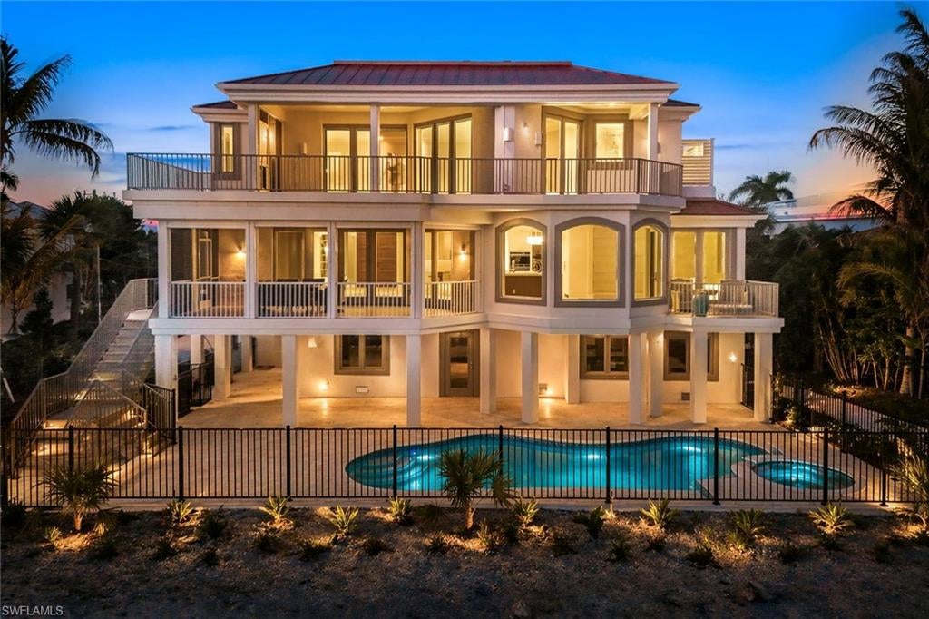 One or more photo(s) has been virtually staged, AI generated or rendered.  Completely Renovated!!!  Exceptional opportunity to own along prestigious West Gulf Drive, one of Sanibel Island’s most sought-after Gulf-front corridors. This premier location offers direct access to the pristine beaches of Sanibel Island, renowned for sugar-white sand, world-class shelling, and breathtaking sunsets over the Gulf of Mexico. Nestled in a quiet, low-density residential setting, properties along W. Gulf Dr. provide a serene island lifestyle surrounded by lush tropical vegetation and coastal preserves. Enjoy miles of unspoiled shoreline, abundant wildlife, and easy access to biking and walking paths throughout the island. Ideal for full-time residence, seasonal retreat, or investment property, this location combines privacy with convenience—just a short drive to local dining, shopping, and marinas. Experience the best of Southwest Florida coastal living in an unparalleled beachfront setting. This completely reimagined beachfront home has been thoughtfully redesigned to offer a like-new coastal retreat featuring a MBR with his and her bathrooms and closets and 3 generous en-suites. Main living area features an open-concept floor plan with expansive impact glass, the home captures sweeping Gulf views and abundant natural light throughout. The all-new chef’s kitchen showcases custom cabinetry, double islands with quartz countertops, and premium appliances in addition to new roof, impact windows and doors, updated electrical, plumbing, private elevator and HVAC systems, and refined coastal finishes throughout. Outdoor living is elevated with extensive landscaping(in the process) a spacious pool deck, redesigned pool area, and direct access to Sanibel’s white-sand beaches—perfect for enjoying breathtaking sunsets year-round. A rare opportunity to own a fully renovated, move-in-ready beachfront property on Sanibel Island.