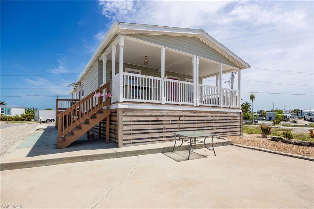 PRICE IMPROVEMENT!! NOW 364,900! 
Direct Gulf Access • Island Vibes • Laid-Back St. James City Living!!

St. James City Waterfront Living — Minutes to Open Gulf Waters!
Welcome to your slice of island life in St. James City on beautiful Pine Island, FL. This direct Gulf-access manufactured home sits on a quiet canal just minutes from open water, offering effortless boating, world-class fishing, and postcard sunsets right from your own backyard.

Step outside and embrace the laid-back coastal lifestyle — fish from your private dock, launch your boat from your 8k lb boat lift for a day on the Gulf, or unwind as the sky glows over the mangroves each evening. This is the kind of place where neighbors wave from golf carts, salty breezes drift through the palms, and every day feels like vacation.

Property & Lifestyle Highlights:

2023 manufactured home with 2 bedroom & 2 bath open concept great for entertaining!
Stainless steel appliances, and a kitchen island with seating to accommodate your guests.
Open and bright functional space with plenty of room for dinner parties.
Large covered deck facing the canal where you can enjoy your morning coffee and watch your neighbors boat by.
Large concrete dock, composite dock and 8k lb boat lift with canopy for your boating adventures!

Direct Gulf access — no bridges, no delays, just pure boating freedom!

Private dock for fishing, kayaking, or keeping your boat ready to go.

Island vibe with maintenance free landscaping and relaxed coastal charm.

Golf-cart friendly community — ride to waterfront restaurants, bars, and shops.

Live music and local seafood minutes away!

Sunset views that make every evening unforgettable.

Whether you’re seeking a weekend escape, a full-time coastal retreat, or a vacation rental opportunity, this home delivers the best of Pine Island living — laid back, waterfront, and wonderfully unhurried.
Schedule your private showing today and discover the relaxed beauty of island living!