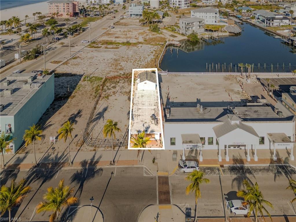 Commercial Development Opportunity in the Heart of Fort Myers Beach

As Fort Myers Beach continues its remarkable transformation, opportunities to own commercial property within the Downtown Core are becoming increasingly limited. With nearby commercial sites already moving into contract, available inventory along Old San Carlos Boulevard continues to shrink, making this an ideal time to secure a position in one of the island's most active redevelopment corridors.

Located at 185 Old San Carlos Boulevard, this Commercial Boulevard (CB) zoned property presents an outstanding opportunity for investors, developers, and business owners alike. The existing structure provides the option to renovate and occupy in the near term, while the site's zoning and location create exceptional possibilities for future redevelopment.

The property enjoys a highly visible location close to Times Square, the Fort Myers Beach Pier, Crescent Beach Family Park, Lynn Hall Memorial Park, and the Gulf of Mexico. Surrounded by restaurants, retail shops, entertainment venues, and popular tourist destinations, the area continues to attract increasing numbers of residents and visitors as redevelopment projects reshape the island.

Ongoing public improvements, private investment, upgraded infrastructure, and new commercial development are helping redefine the Downtown Core into one of Southwest Florida's premier coastal destinations. This continued momentum offers significant long-term potential for businesses seeking to establish a presence in an expanding market.

Commercial Boulevard zoning supports a broad range of permitted uses, including retail, restaurant, office, bar, hospitality, residential, and mixed-use projects. Whether your plans involve creating a destination dining experience, boutique retail space, professional offices, vacation accommodations, or a multi-level mixed-use development, this property offers the flexibility and location to bring those plans to reality while benefiting from the continued growth of Fort Myers Beach.  Some Seller financing may be available.