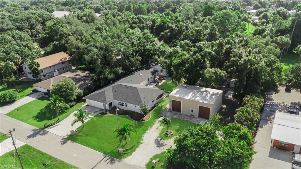 Rare Opportunity with Exceptional Space and Endless Possibilities! Situated on an oversized 29,403-square-foot lot (over half an acre), this unique property offers an abundance of space, versatility, and future potential.

The remodeled main residence features 3 bedrooms, 3 bathrooms, and a 2-car garage, providing comfortable living with modern updates. An additional extension offers flexible space that may be ideal for guests, extended family, or other uses permitted by local regulations.

Also located on the property is a second building currently under construction, designed with 3 bedrooms, a living room, kitchen, and bathrooms, offering excellent potential for future use, subject to obtaining any necessary approvals and verification of permitted uses by the buyer.

Adding to the property's appeal is a substantial 30' x 40' concrete block building with two oversized 18-foot bay doors and its own separate electrical service. This impressive structure provides abundant space for vehicle storage, boats, RVs, equipment, hobbies, or workshop use, subject to local regulations.

With over half an acre of land and multiple structures already in place, this property offers a rare combination of space, flexibility, and opportunity. Buyers are encouraged to verify all measurements, permits, zoning, and intended uses with the appropriate governmental authorities.