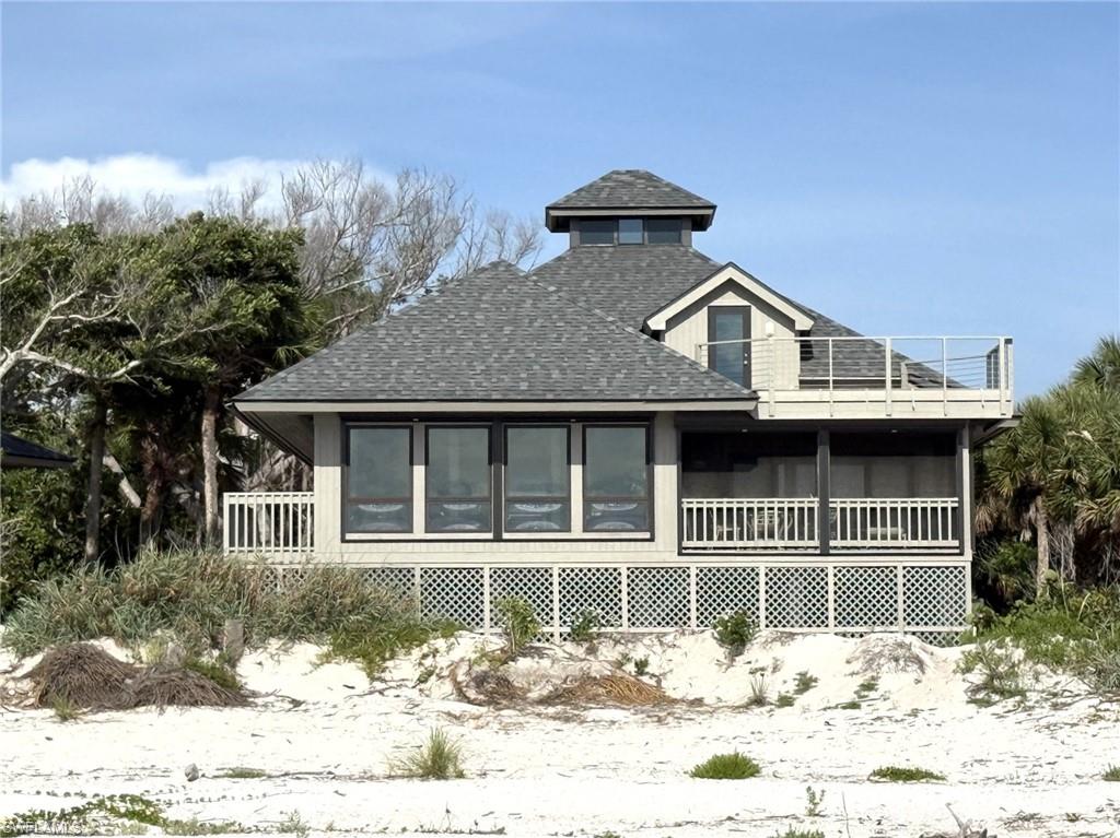 GREAT OPPORTUNITY! This is Your Chance for a LARGE PRIME GULF FRONT BEACH HOME! This AMAZING Home is RIGHT ON THE BEACH WITH PRIVATE BEACH ACCESS just steps out the door. SIMPLY SPECTACULAR OCEANS VIEWS from the entire beach side of this property! This Large Beach Home is located in the Fantastic Safety Harbor Club offering the availability of Shared Boat Dockage for it’s Members – A Commodity that Boaters will Love! Safety Harbor also features A Community Pool, Clubhouse, Tennis/Pickleball Courts etc. Located on an OVERSIZED Lot on the Wide Sugar Sand of Butterfly Beach - this 2400 SQ FT+ Beach House with a Great Room Floor Plan offers Three Bedrooms, Three Full Baths, Over 2400 Plus Square Interior Footage, PLUS a Loft and Interior Storage Room. With its' Bright Huge Main Living Area with SOARING Ceilings, Beautiful Recess Lighting, Coffered Ceilings, Large Kitchen and Breath-Taking Oceans Views you can envision the FULL Potential of this Beach Front Beauty right upon your entry! Two BRs have Ensuite Full Baths. There is also a Fantastic Screened Balcony with access off of the Primary BR and Living Room, a Large Open Balcony off of the Loft offering Superb Gulf Views and Unforgettable Sunsets and a Nice Side Deck! Great Under House Area offers Plenty of Enclosed Storage and Covered Carport Areas. All New Recent Upgrades Include: New Roof and Gutters. Three New AC Units. New Water Heater. New Hurricane Shutters with Hand Cranks and Motors. New Hurricane Door(s) Loft, Both Sets of Sliders in the Living Room, Sliders in the Primary Bedroom and Refrigerator. Windows are all Hurricane Impact Rated per seller. New Hunter Fans in the Main Living Area - Sitting Area, Dining and Kitchen plus new fans in the Loft, Guest and Primary BR. New Lighting Primary BR. The Home’s Interior is Freshly Painted and there is New Exterior Paint. Two Baths are Remodeled with all New Showers, Vanities, Faucets, Mirrors etc. New Kitchen Faucet, Fan, Microwave. New Dehumidifiers with Custom Drains to exterior. Etc. Schedule Your Showing Today to see all that this Beach Home has to offer! It is a MUST SEE!