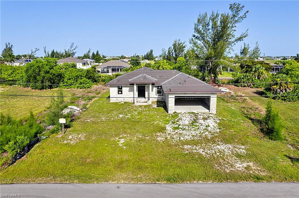 Outstanding opportunity to complete this unfinished new construction home situated on a freshwater canal in desirable NW Cape Coral. Currently designed to offer approximately 1,658 square feet of living space, the planned floor plan features 4 bedrooms, 2 bathrooms, and is positioned on a .23-acre waterfront homesite.

Construction has been started, providing a valuable head start for a builder, investor, contractor, or buyer looking to customize the finishes and create a beautiful waterfront residence. The thoughtfully planned layout offers the potential for comfortable everyday living while taking advantage of the peaceful freshwater canal setting.

Buyer will be responsible for handling any open/expired permits.

Enjoy the benefits of Cape Coral's growing Northwest area with convenient access to shopping, dining, parks, schools, and recreational opportunities. Whether you're looking to build equity, add to your investment portfolio, or complete your future home, this property offers exceptional potential.

The property is being sold **as-is** in its current unfinished condition. Buyer will be responsible for completing construction and is encouraged to verify all permitting, inspections, and completion requirements with the appropriate local authorities.