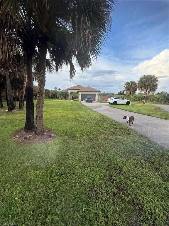 Discover this beautiful, spacious home in Golden Gate Estates, Naples, situated on 2.5 acres. The property features four bedrooms, three bathrooms, and a two-car garage, with 2,064 square feet of living area and 2,486 total square feet. Enjoy the space and possibilities this generous property offers.